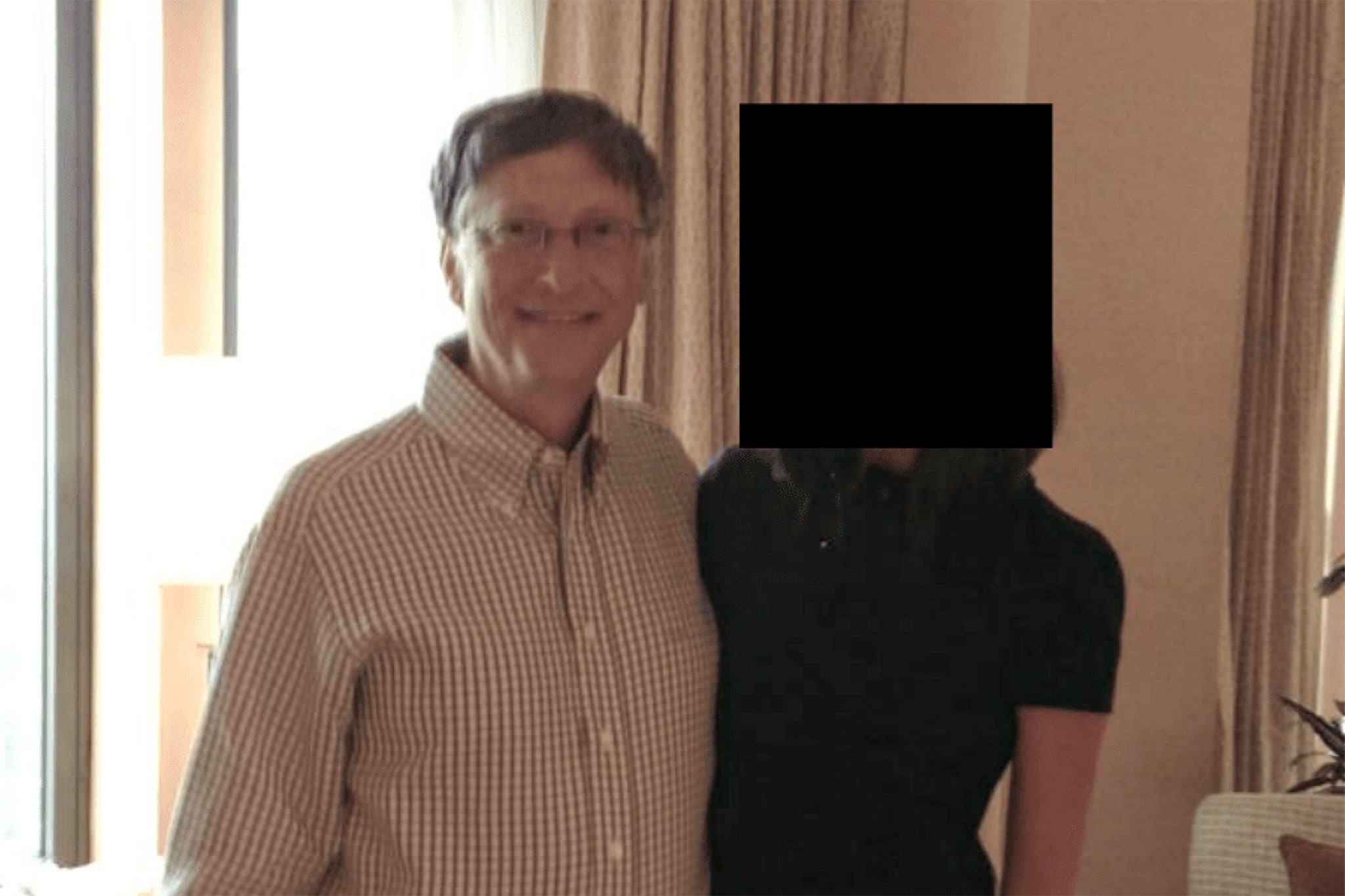 Bill Gates with unknown woman in photo released by DOJ from the Epstein Files