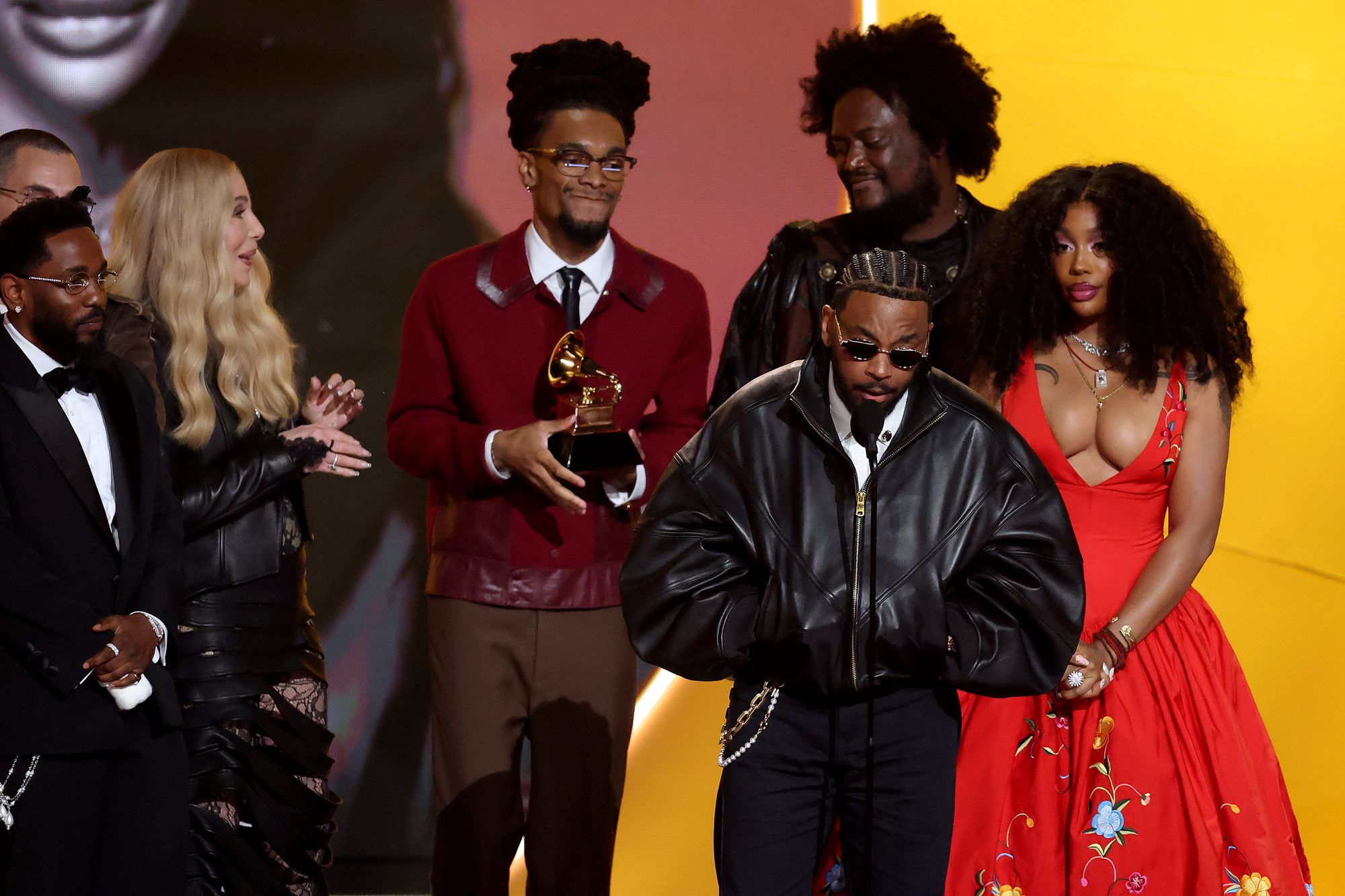 Kendrick Lamar (with SZA, right) accepting Record of the Year for their collaboration, ‘Luther’