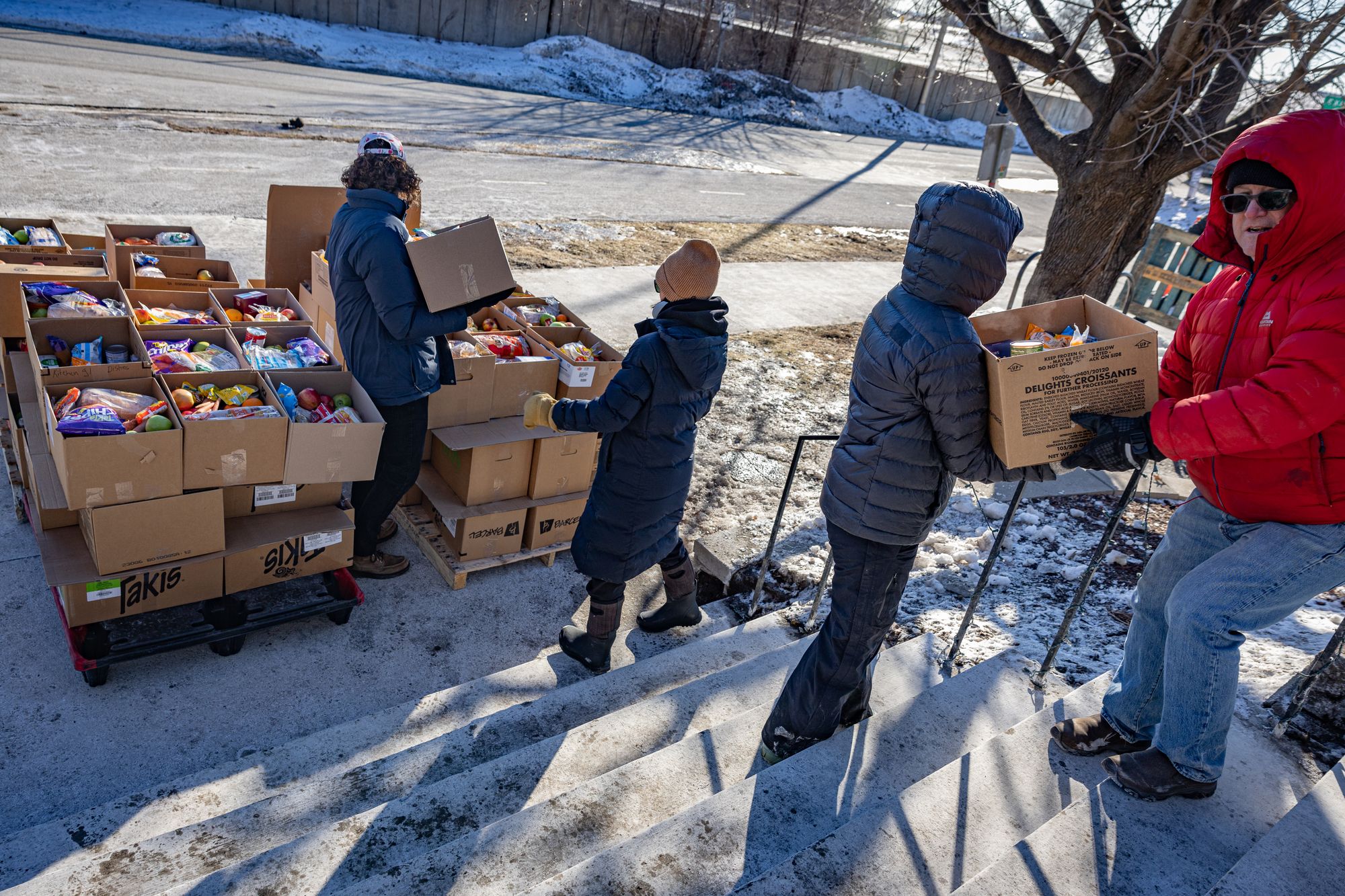 Volunteers at the DHH church load hundreds of boxes of food supplies ready to deliver to vulnerable families in Minneapolis