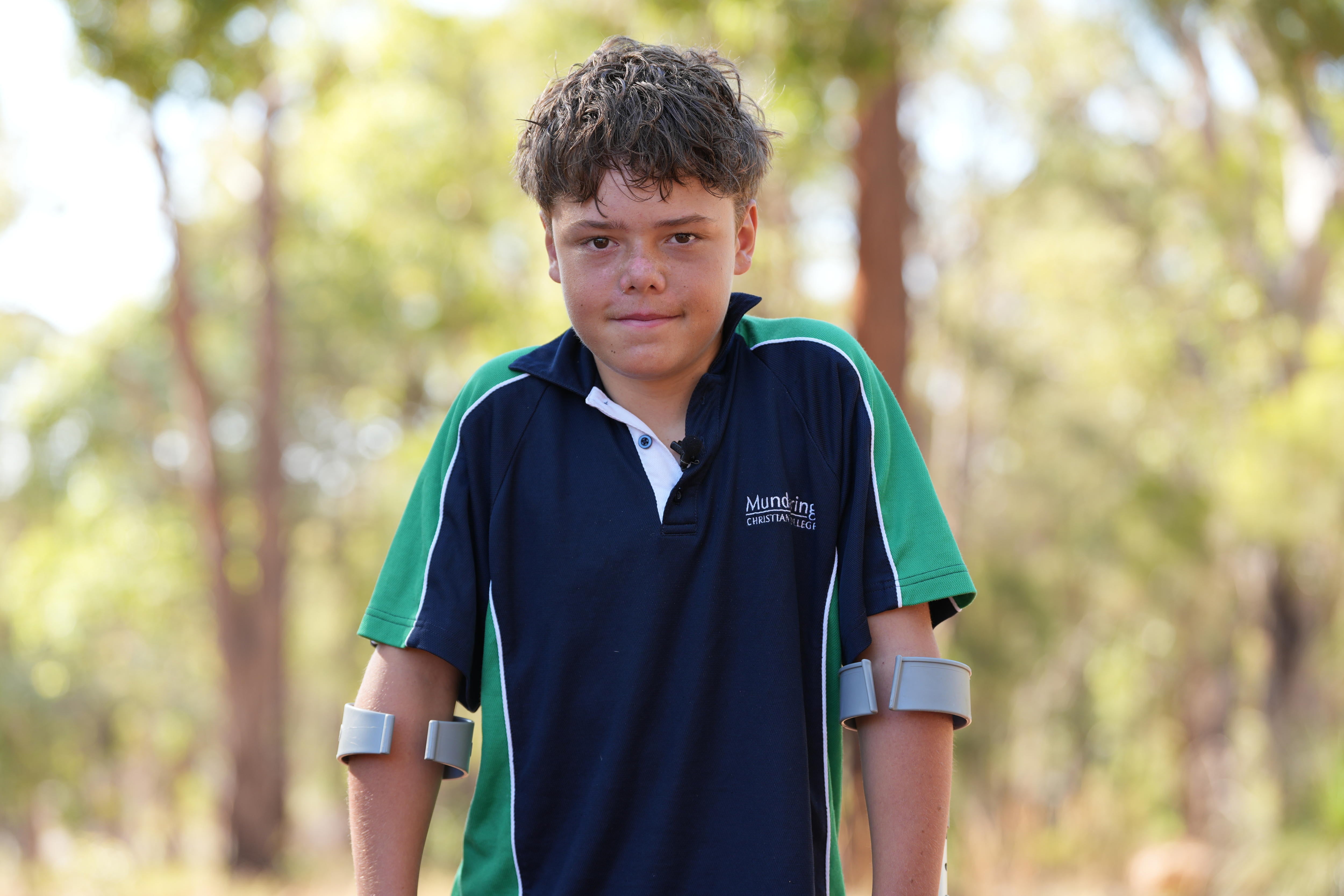 <p>Austin Appelbee poses for a photo in Gidgegannup, Australia, after being hailed for his heroic effort in rescuing his family </p>