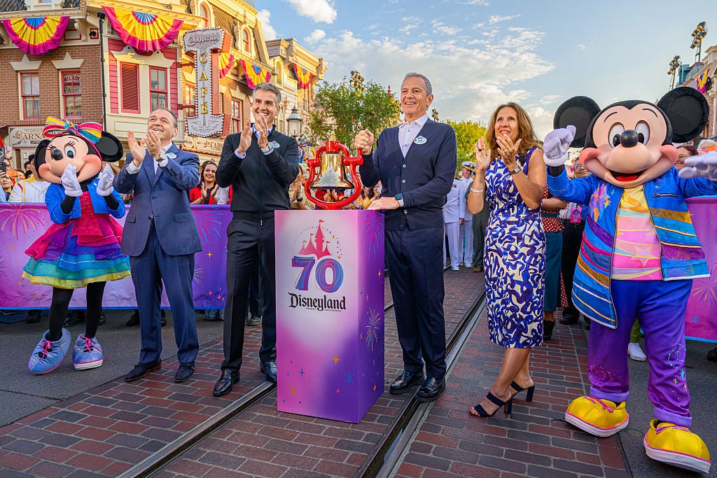 Josh D’Amaro, second from left, seen here at a 70th anniversary celebration at Disneyland, will replace Bob Iger as Disney’s chief executive officer.