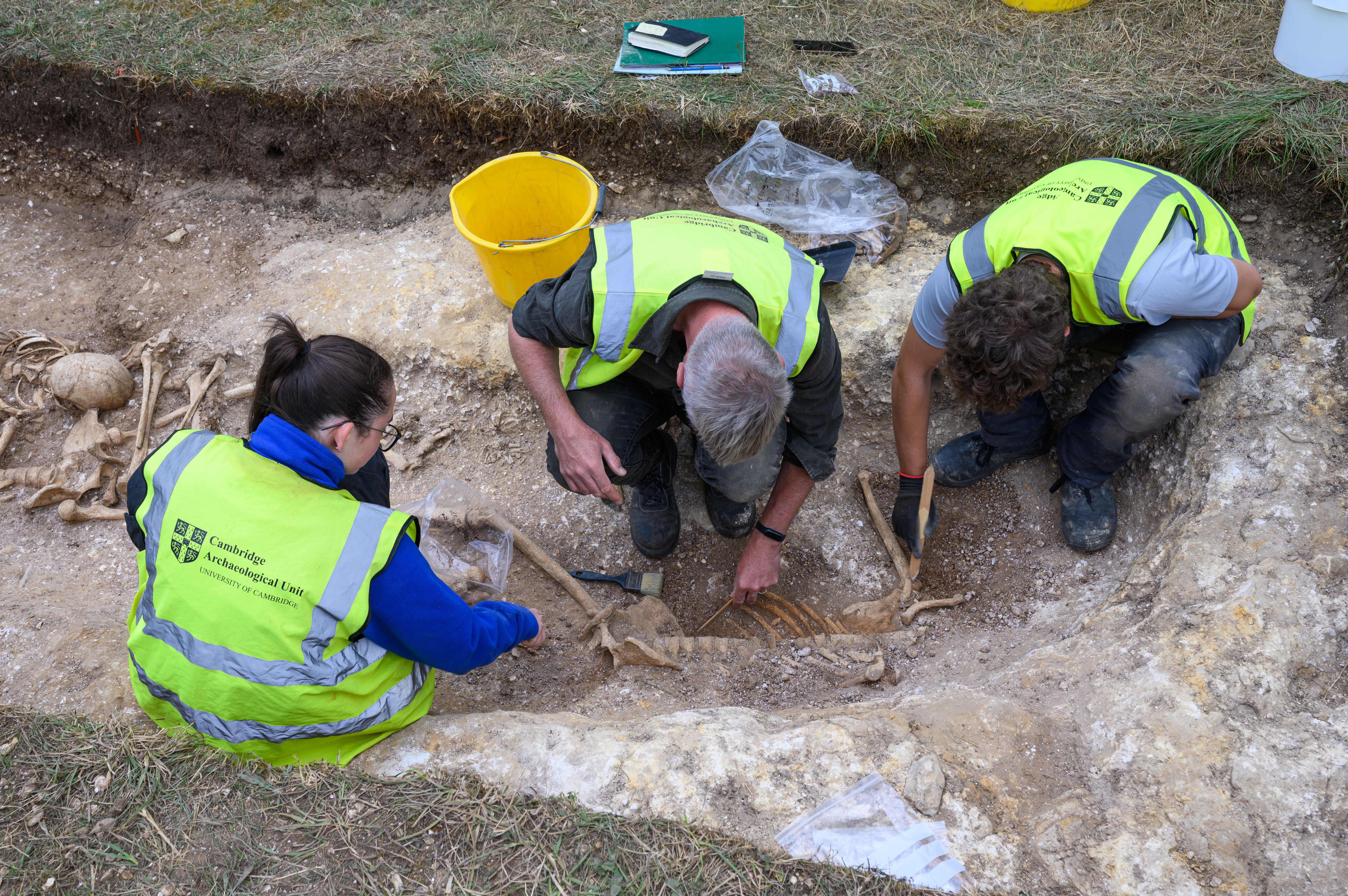 Students unearth ancient burial pit with decapitated remains
