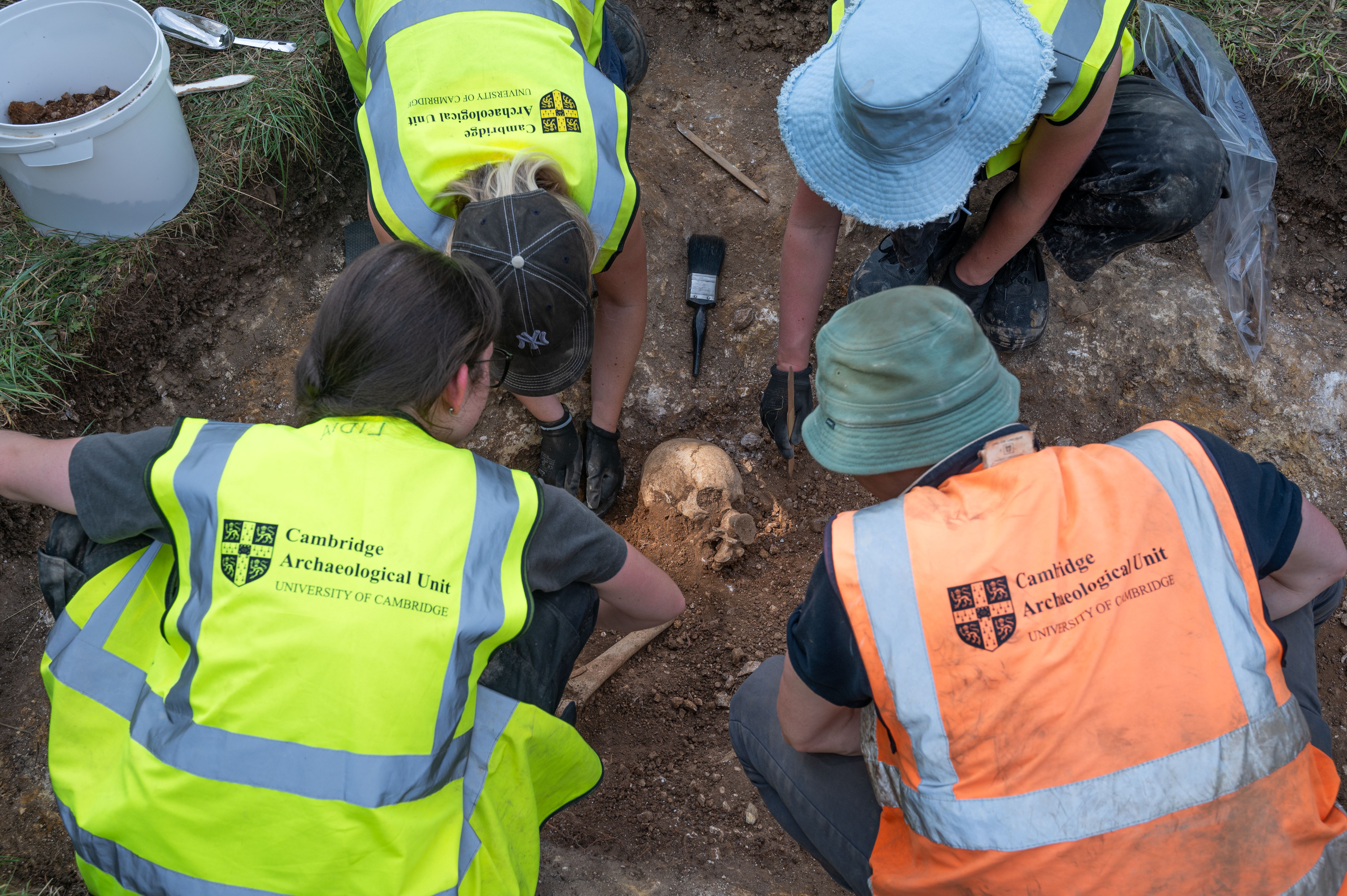 Cambridge University students helped discover a burial pit containing the remains of at least 10 people, possibly Vikings or Saxons
