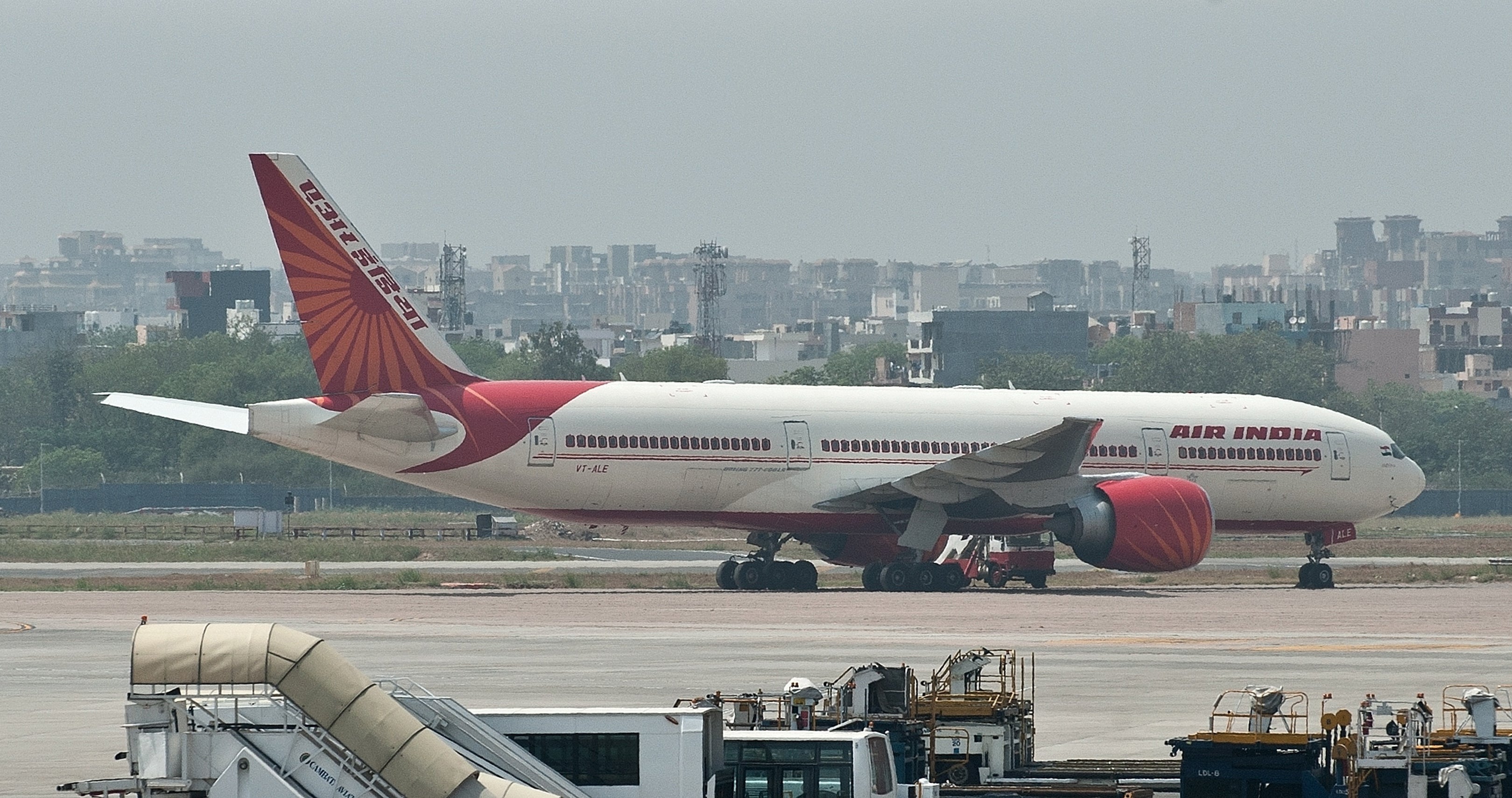 <p>File. Air India plane is seen parked on the tarmac at the Indira Gandhi International Airport in Delhi</p>