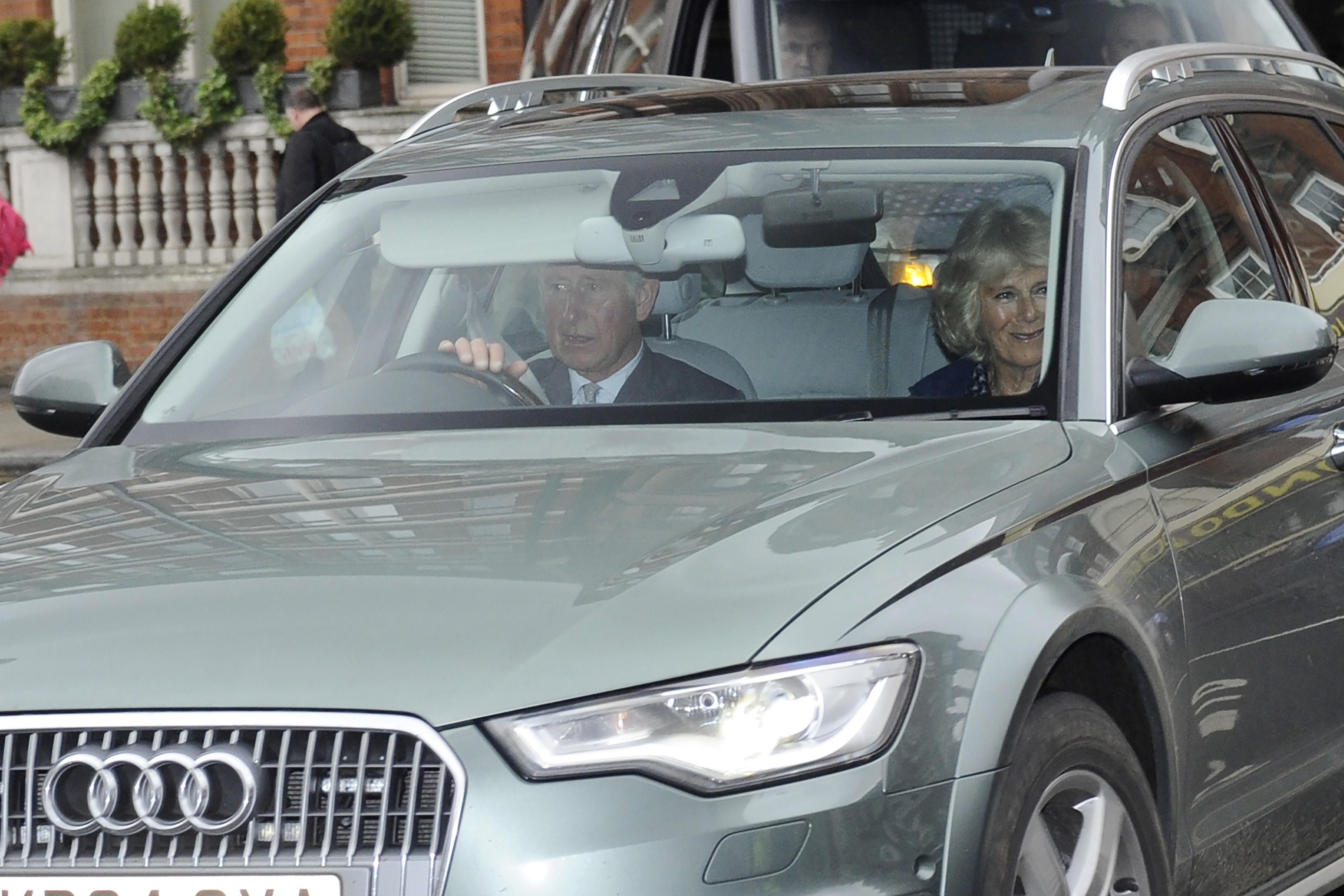 Then-Prince Charles and the Duchess Of Cornwall inside the Audi as they arrived at Kensington Palace to visit the Duke and Duchess of Cambridge