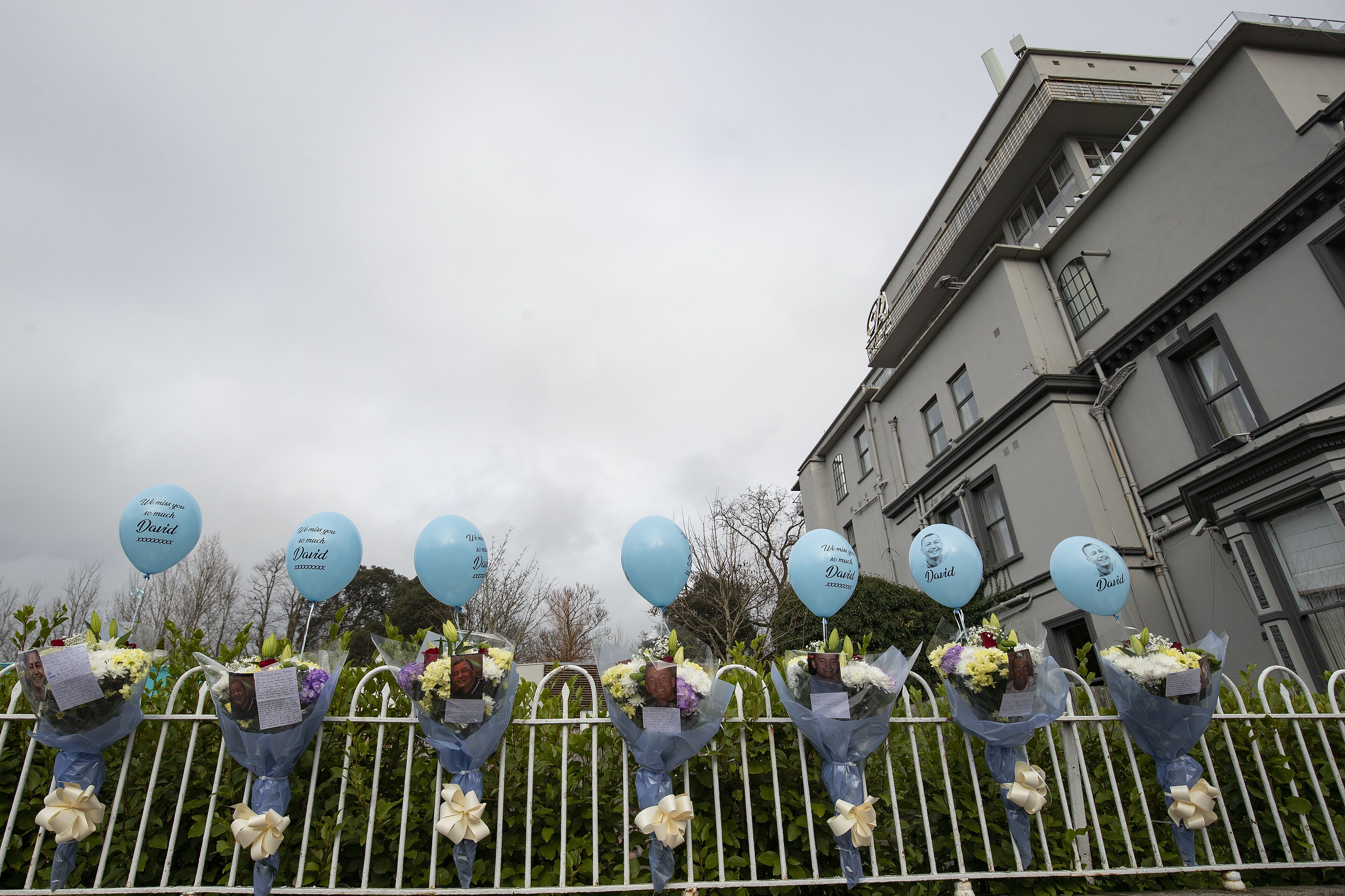 Balloons, flowers, photos and messages at the site of the former Regency Hotel in Dublin (Brian Lawless/PA)