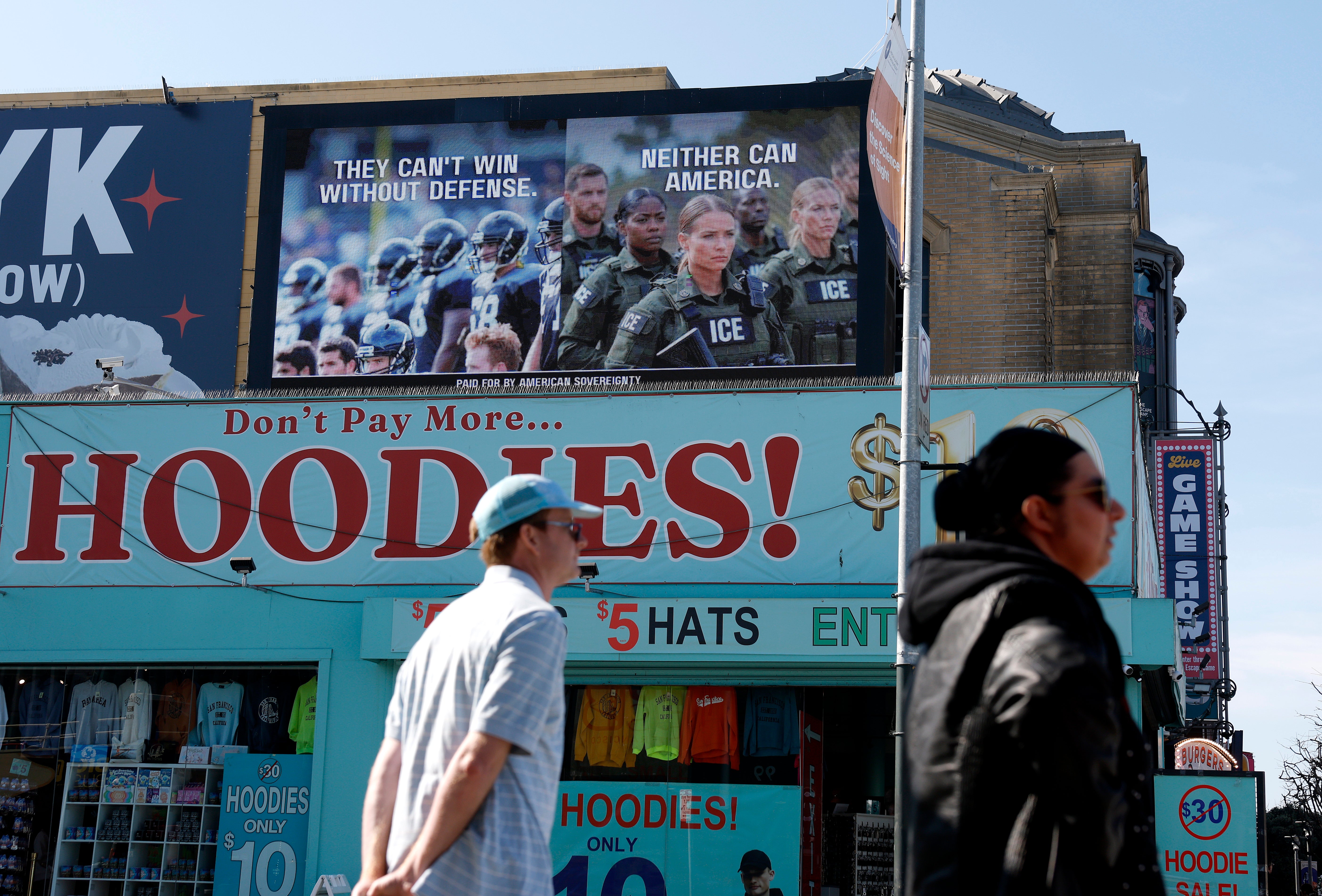 'They can't win without defense,’ the digital billboard states. 'Neither can America'