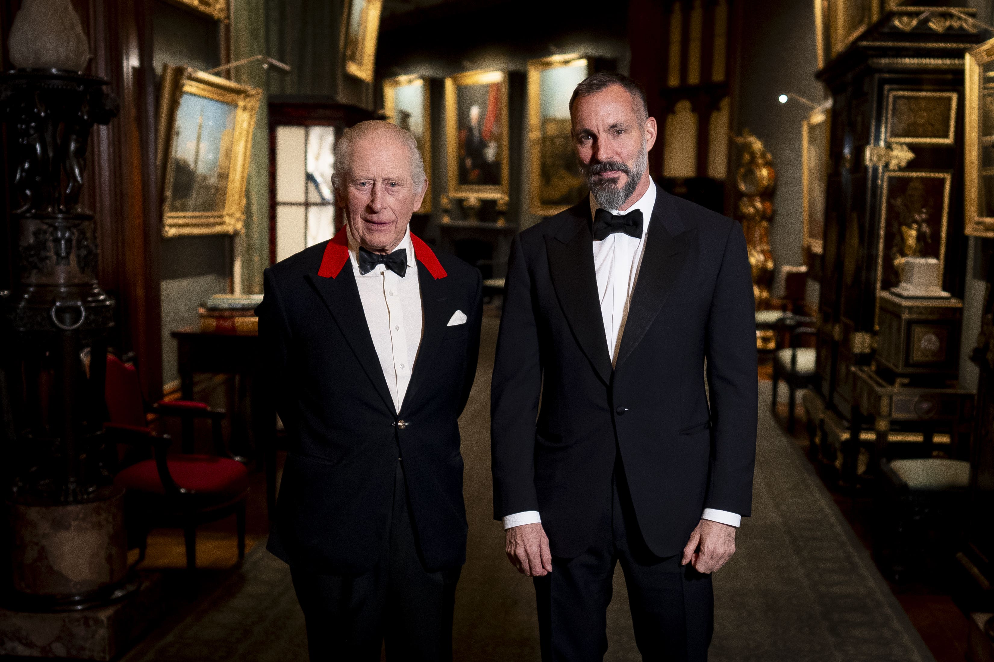 The King with the Aga Khan in the Grand Corridor of Windsor Castle (Aaron Chown/PA)