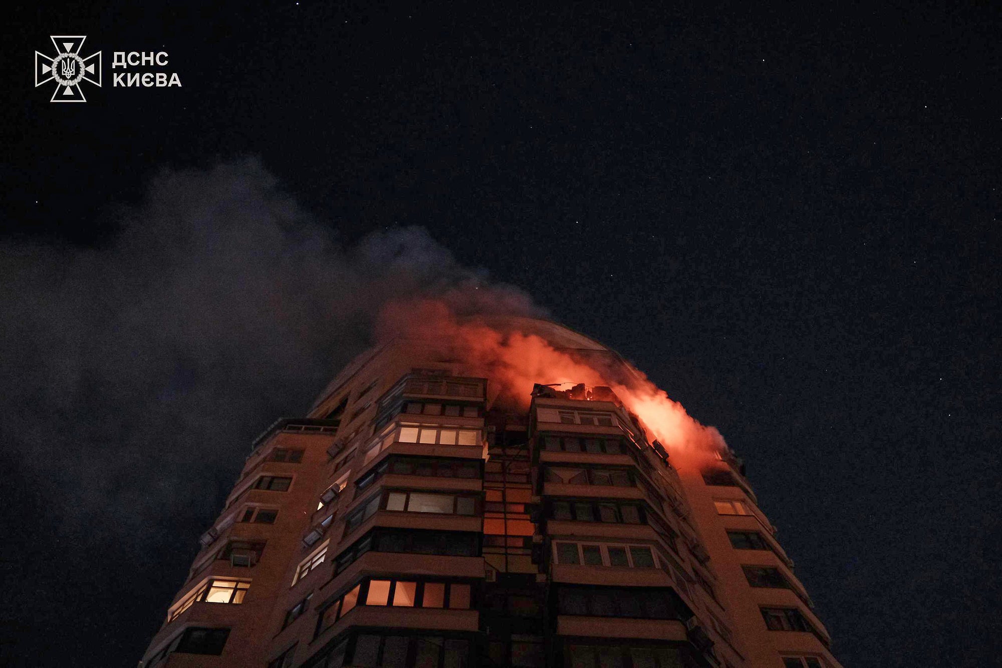 In this photo provided by the Ukrainian Emergency Service, emergency services personnel work to extinguish a fire at a multi-storey apartment building following a Russian attack in Kyiv, Ukraine, Tuesday, Feb. 3, 2026. (Ukrainian Emergency Service via AP)