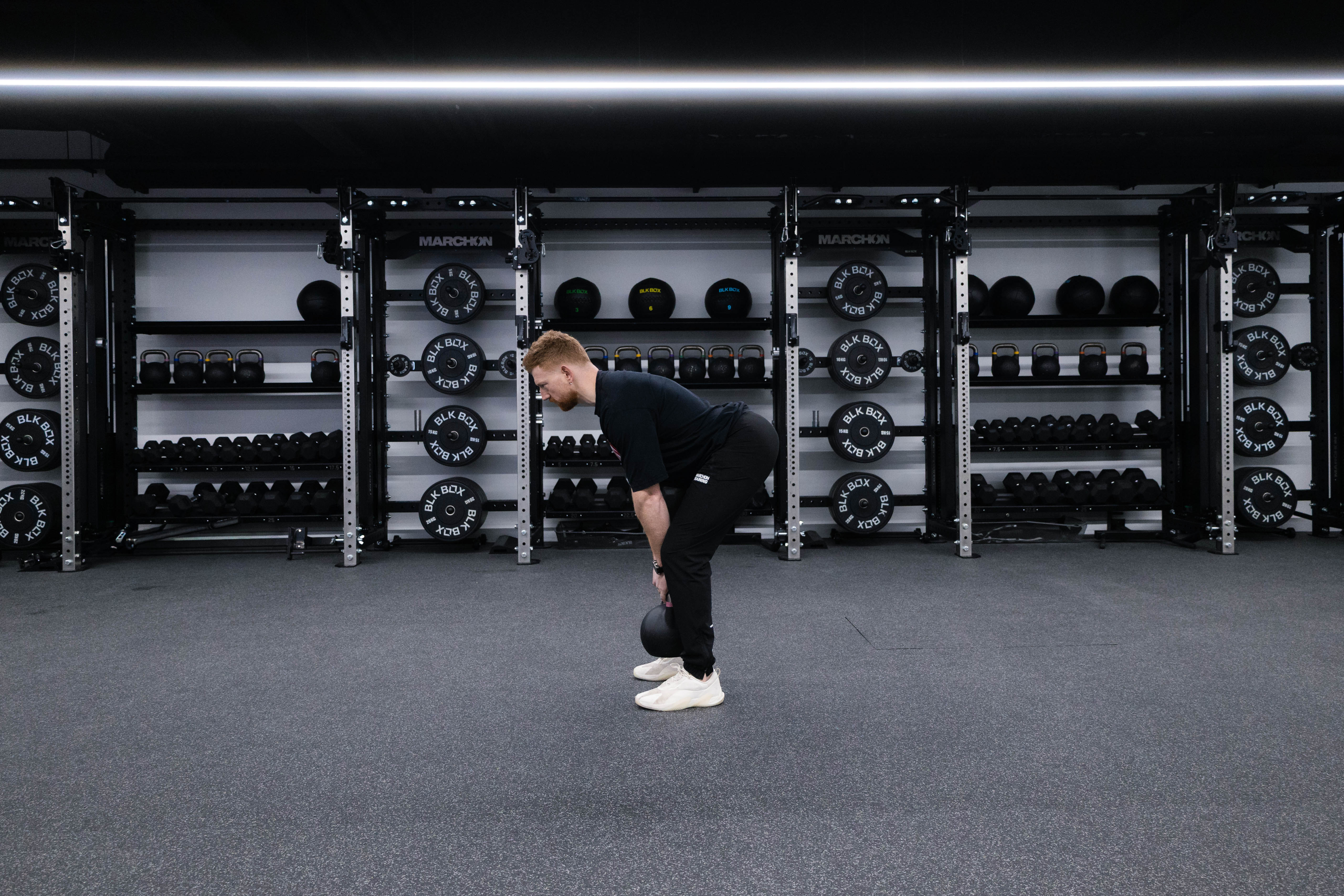 Marchon coach Patrick James demonstrating a Romanian deadlift
