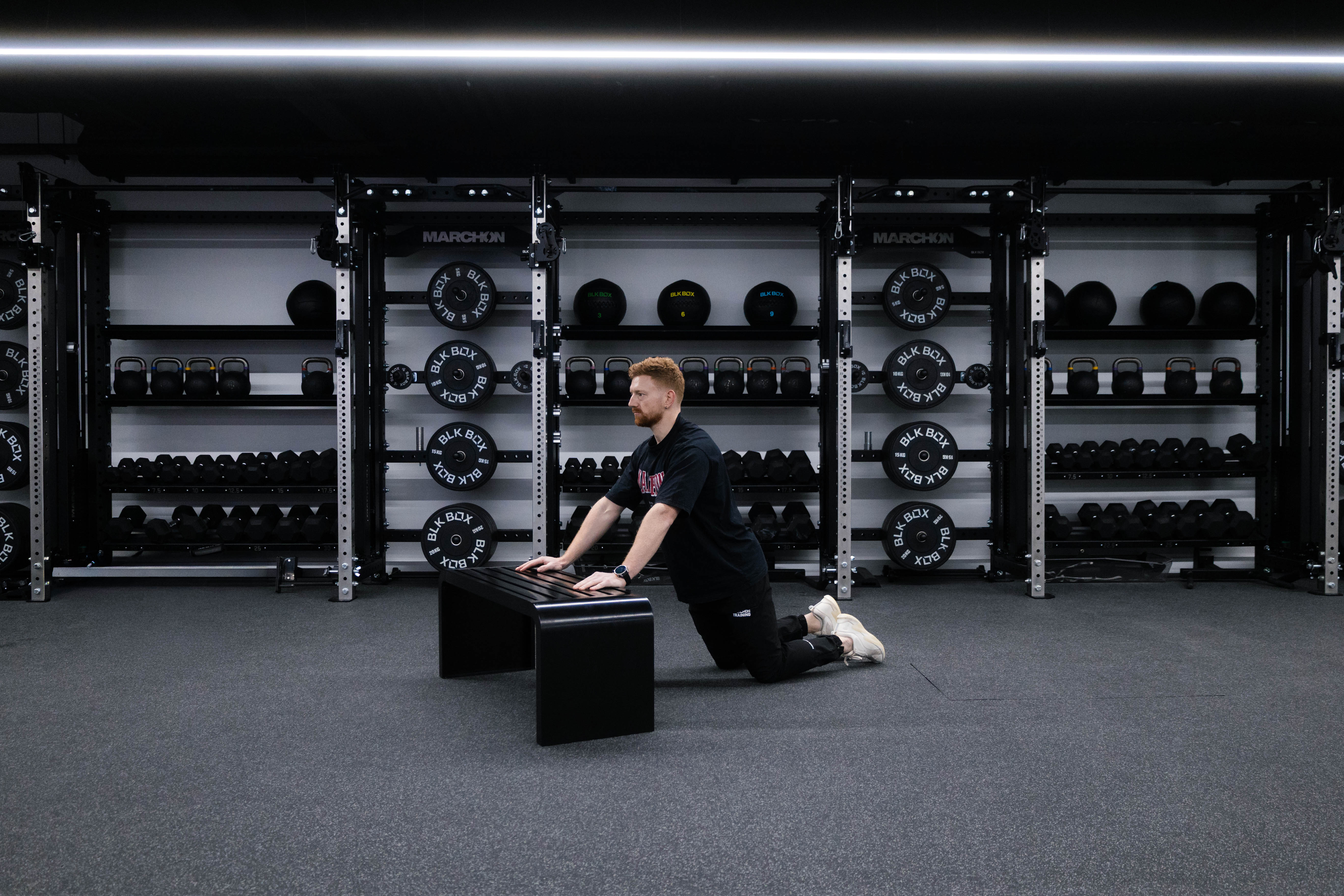 Marchon coach Patrick James demonstrating a kneeling hands-elevated press-up