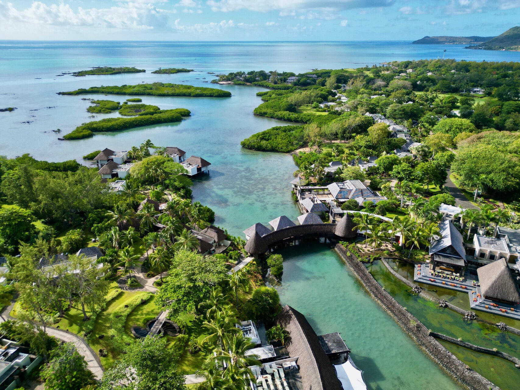 Two parts of the resort are connected by a bridge over a lagoon