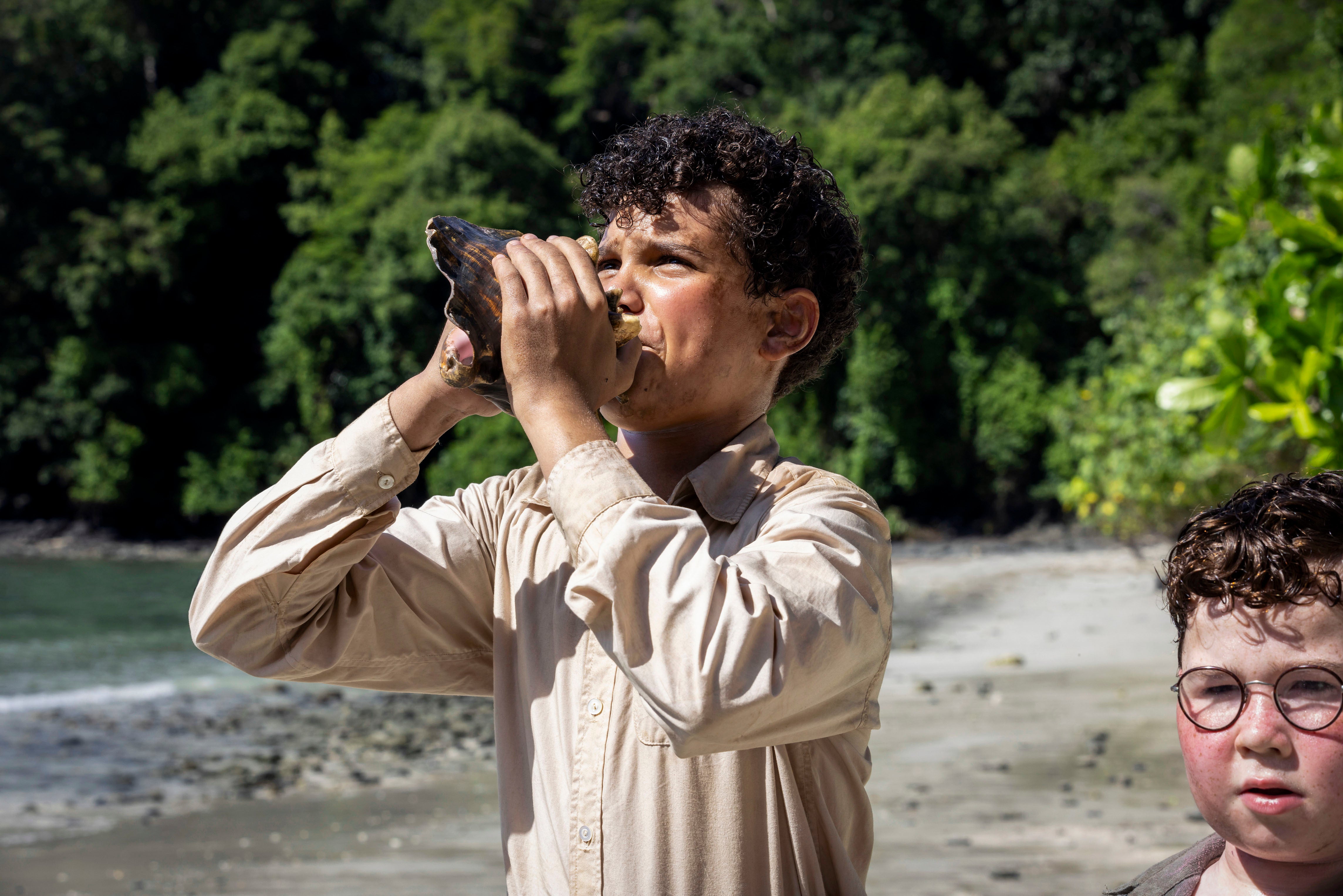 Winston Sawyers as Ralph, holding the conch