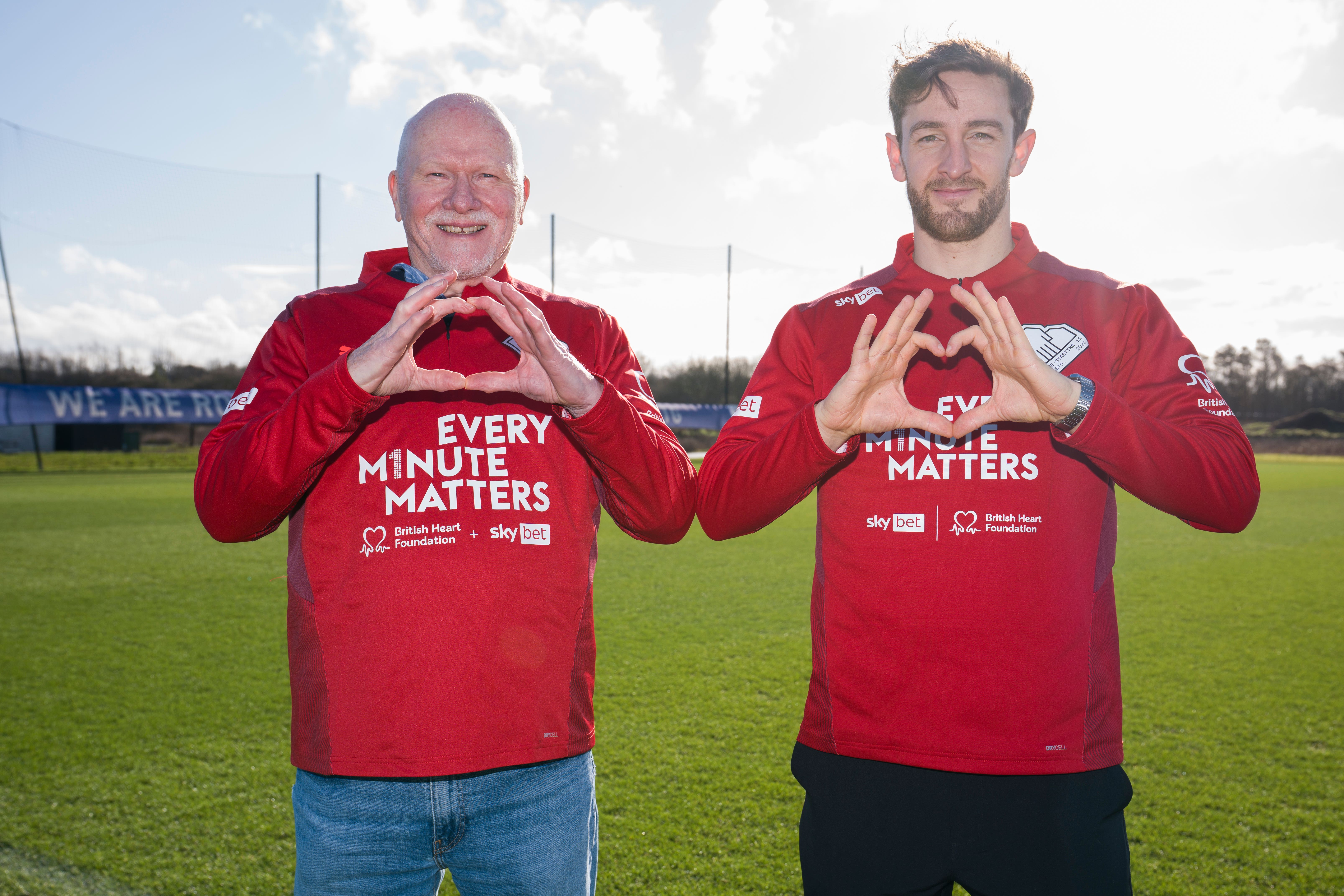 Every Minute Matters campaign ambassador Tom Lockyer alongside Wrexham fan and cardiac arrest survivor Maurice Jones, who are calling on the nation to ‘Show your Heart’ and learn CPR as part of Sky Bet and British Heart Foundation’s mission to get 500,000 people to learn the lifesaving skill this February Heart Month (PA)