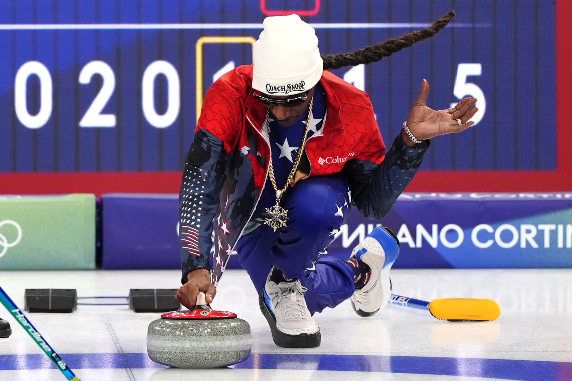 American rapper Snoop Dogg (right) practices curling with the USA team at the Winter Olympics (Andrew Milligan/PA)