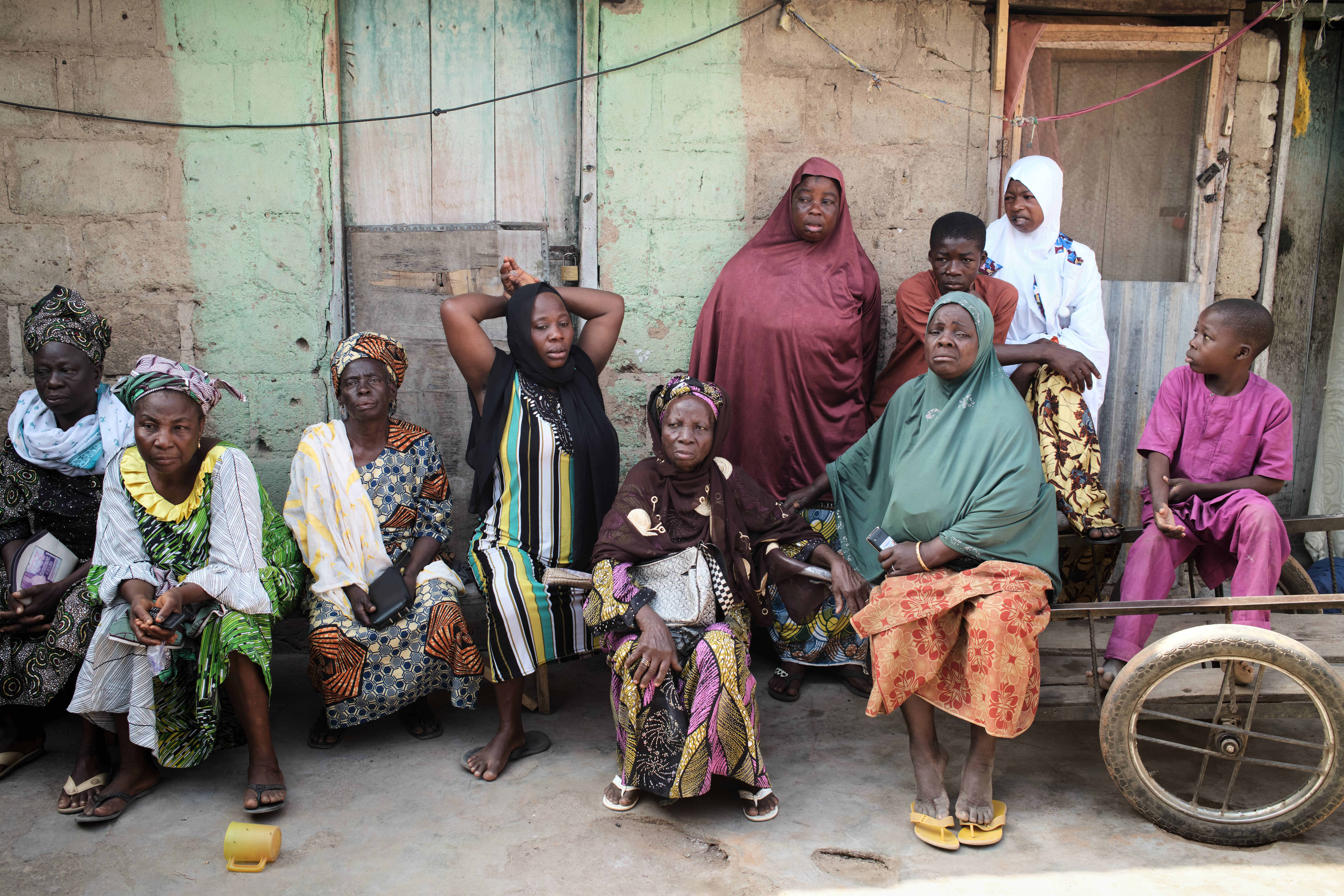 Survivors gather on the third day of Islamic prayers for one of the victims of an extremist attack, in Kaiama.