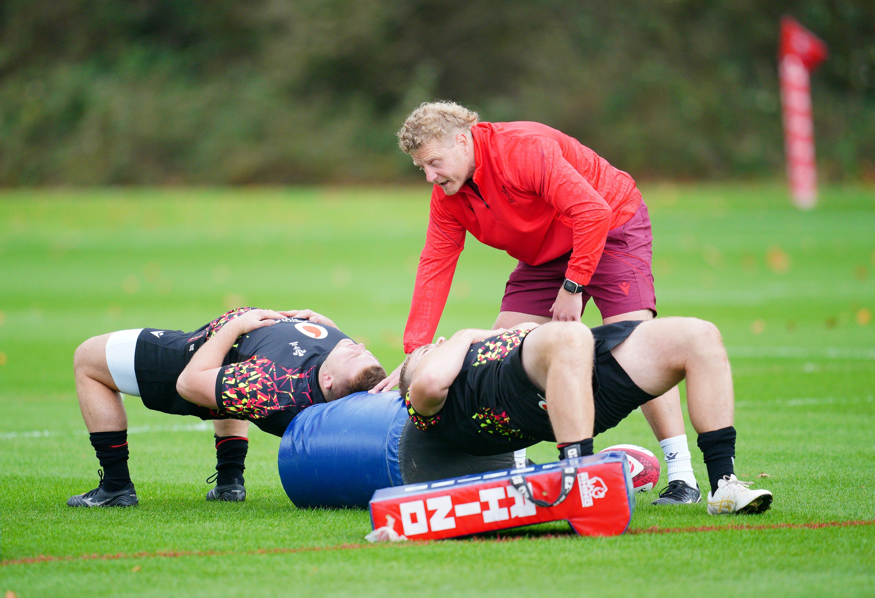 Scrum coach Duncan Jones (standing) was injured at a training session this week