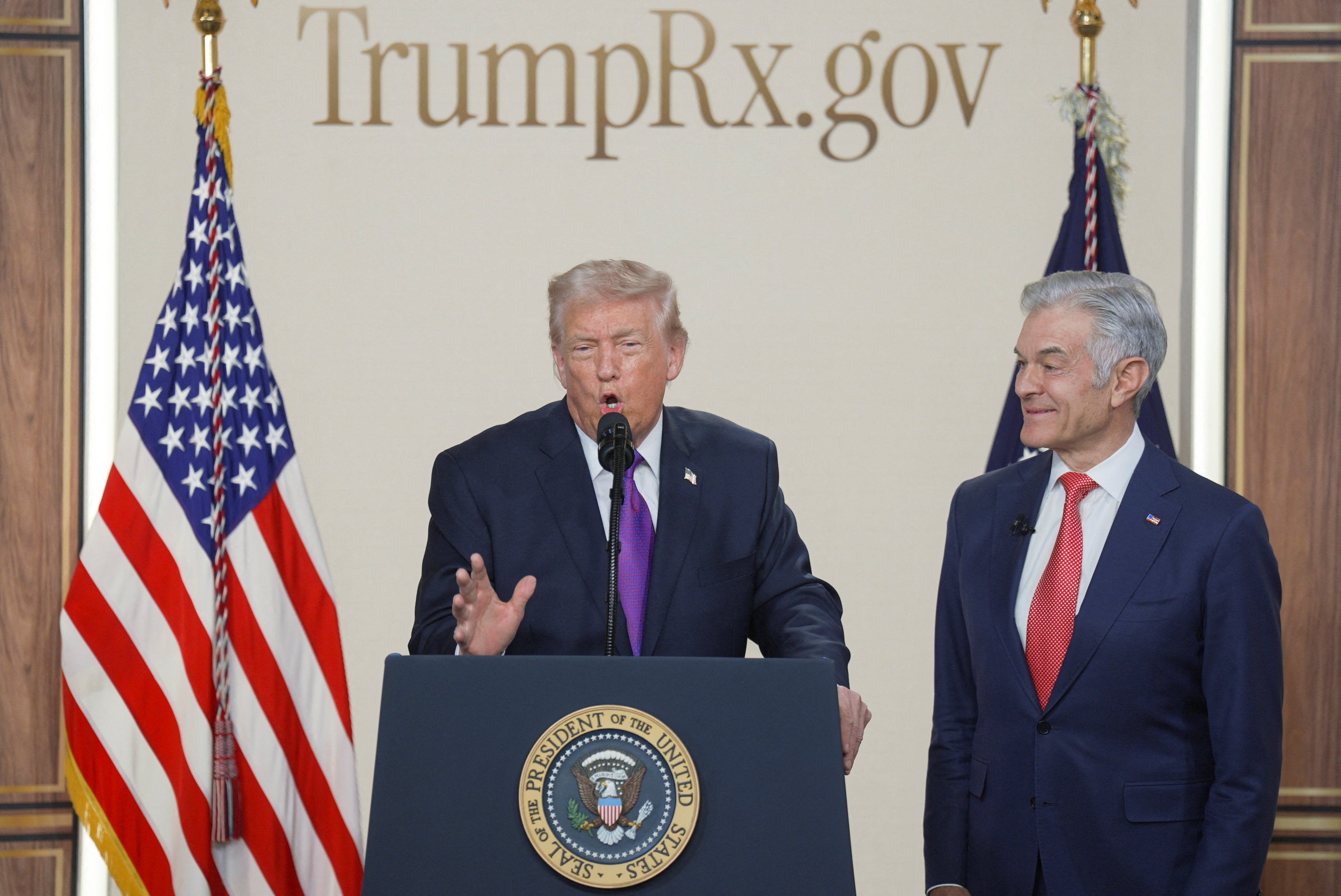 U.S. President Donald Trump speaks during an event to unveil the TrumpRx drug discount site, as Administrator for the Centers for Medicare and Medicaid Services Dr. Mehmet Oz reacts, in the South Court Auditorium on the White House campus, in Washington, D.C., U.S., February 5, 2026