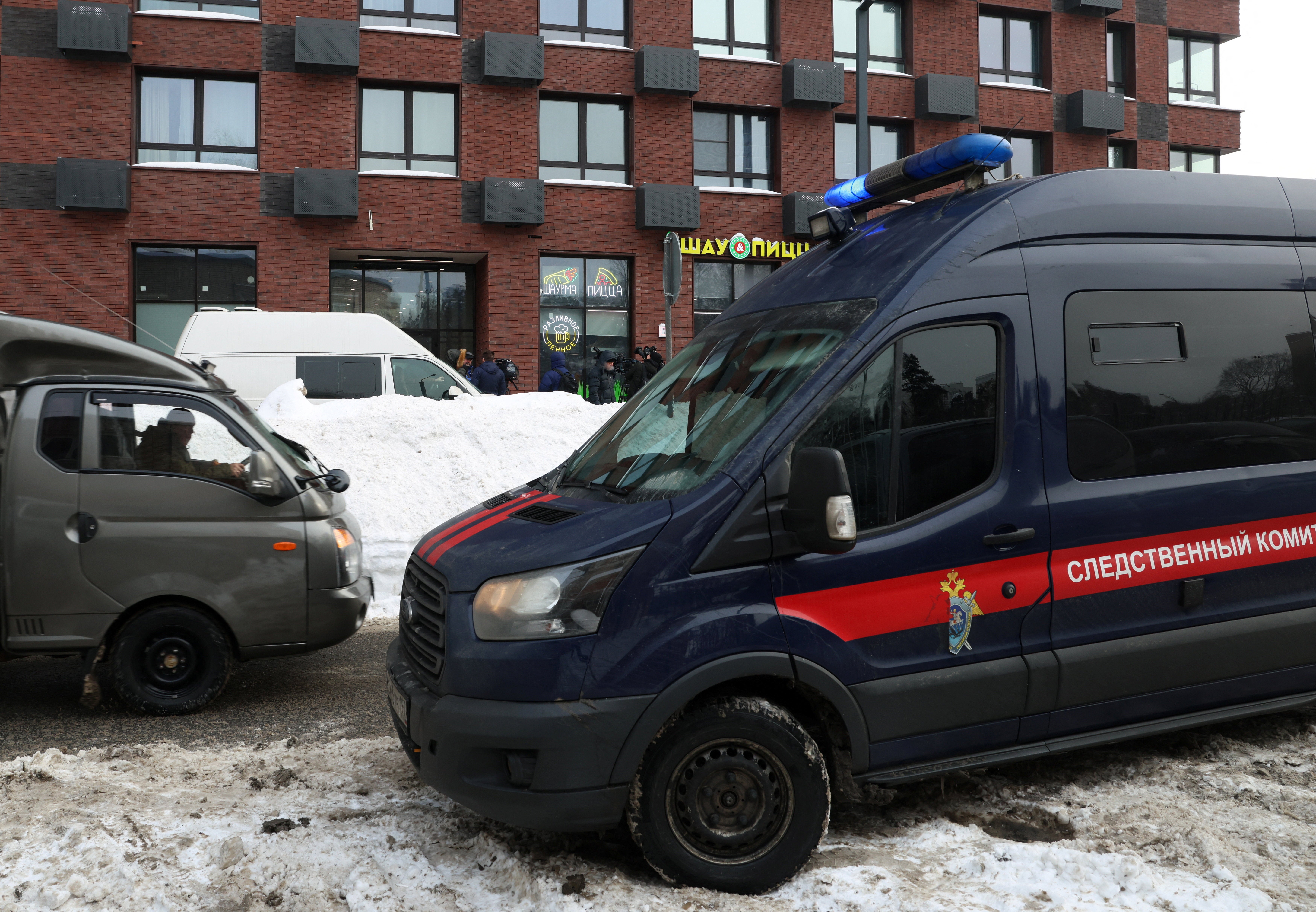 A Russian Investigative Committee van parked outside the building where the assassination attempt took place