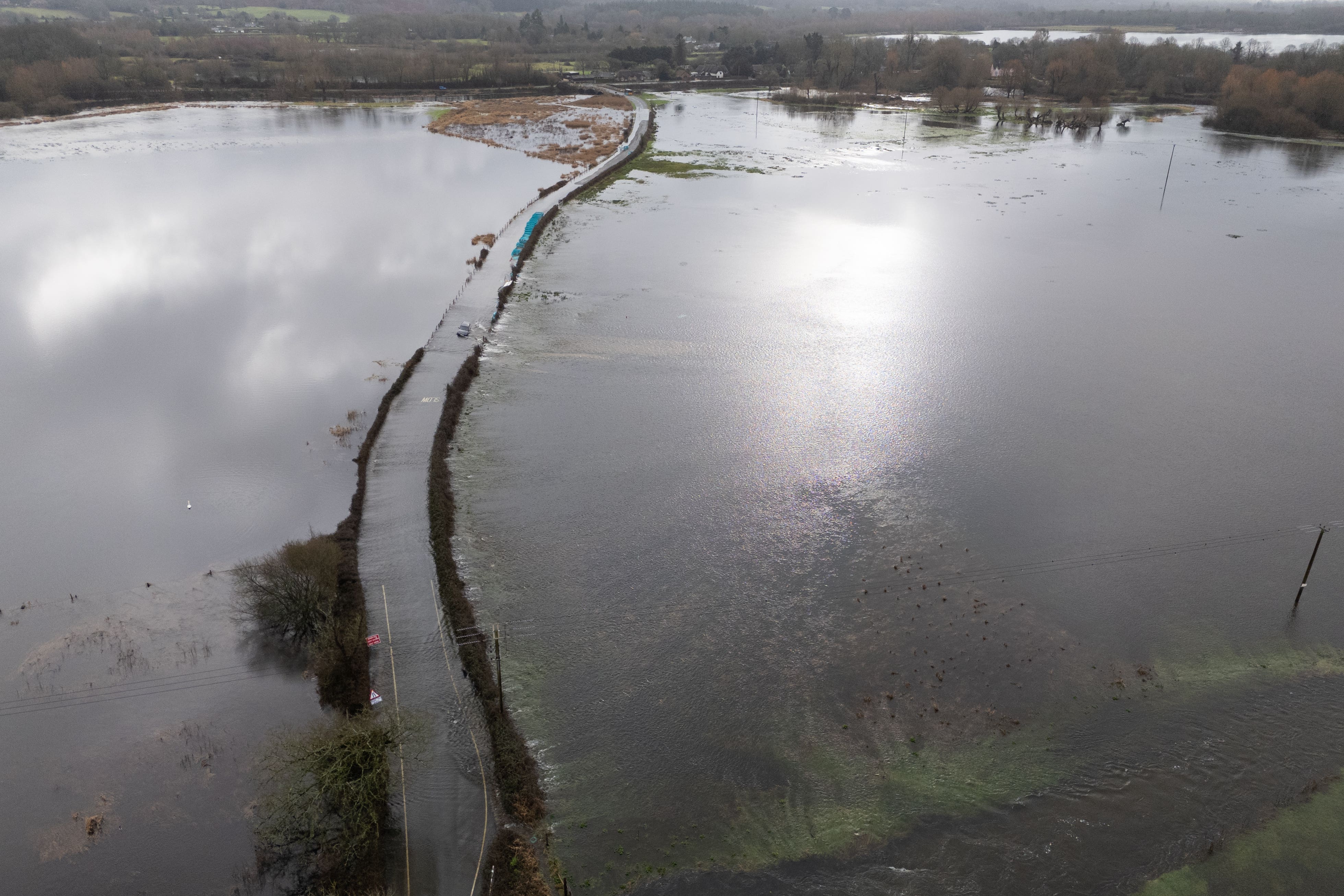 Flood water covers a road near Harbridge, Hampshire (Andrew Matthews/PA)