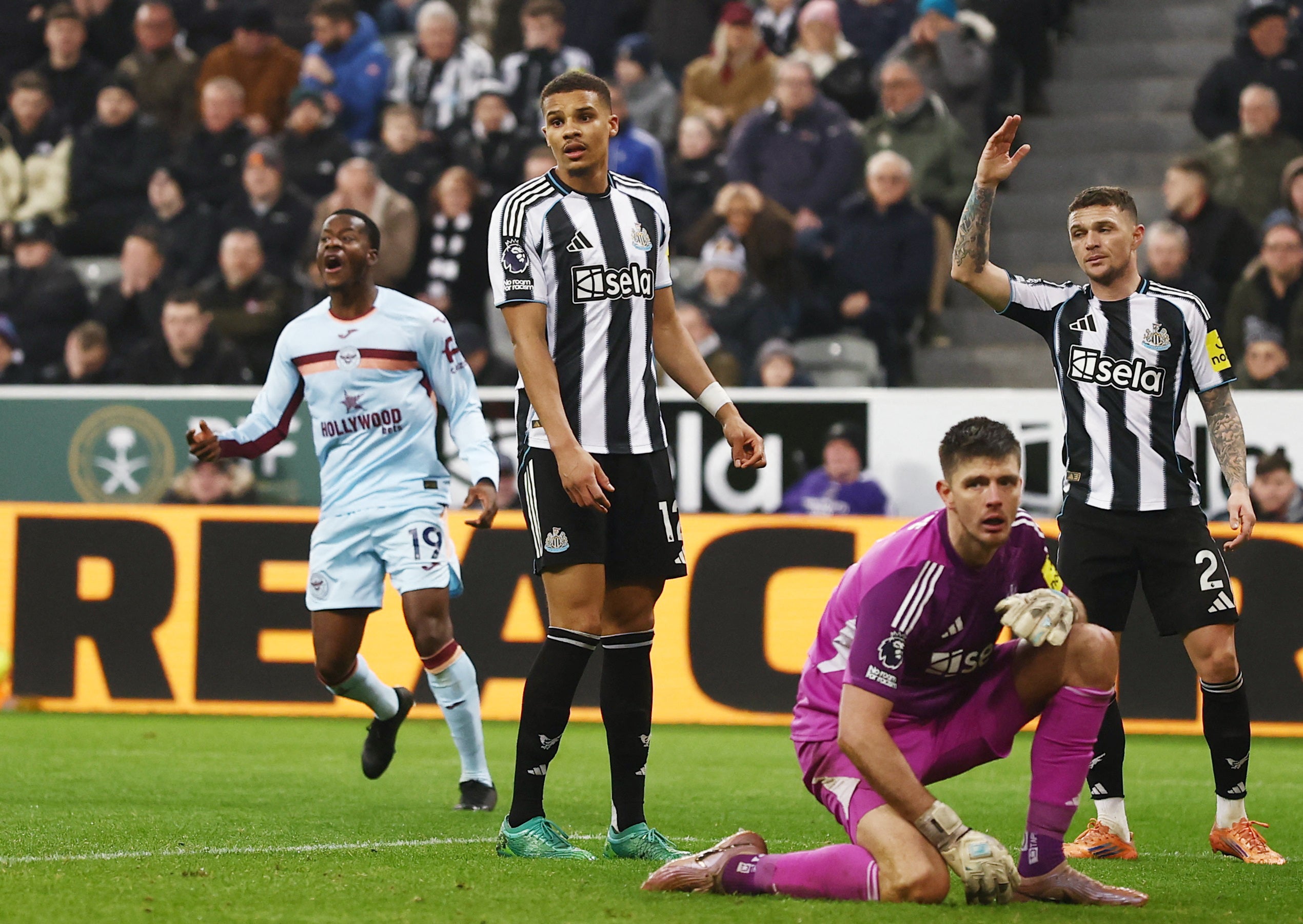 Newcastle United's Kieran Trippier, Newcastle United's Nick Pope and Newcastle United's Malick Thiaw react after Brentford's Dango Ouattara scored their third goal