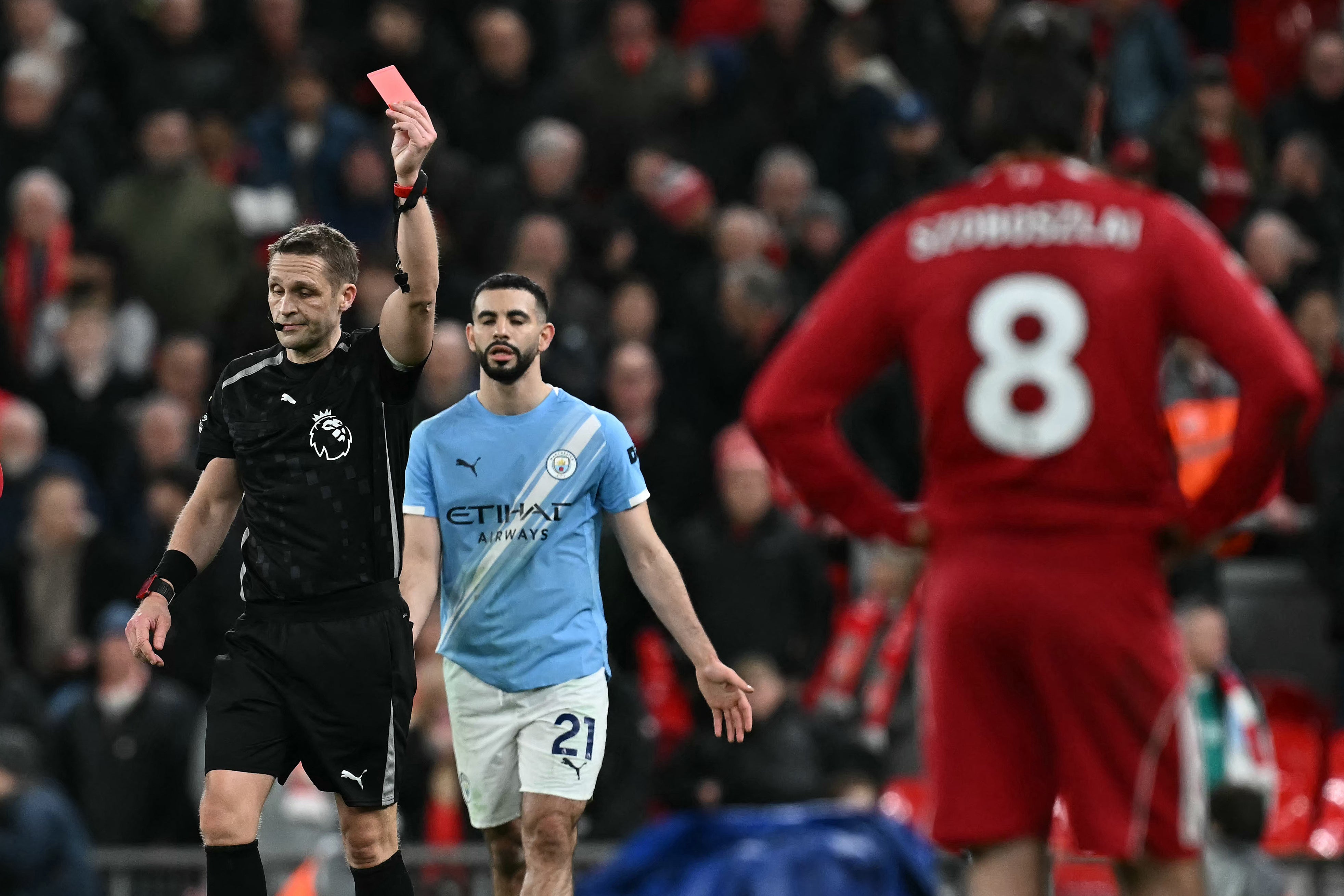Craig Pawson sends off Szoboszlai at the end of City's victory at Anfield