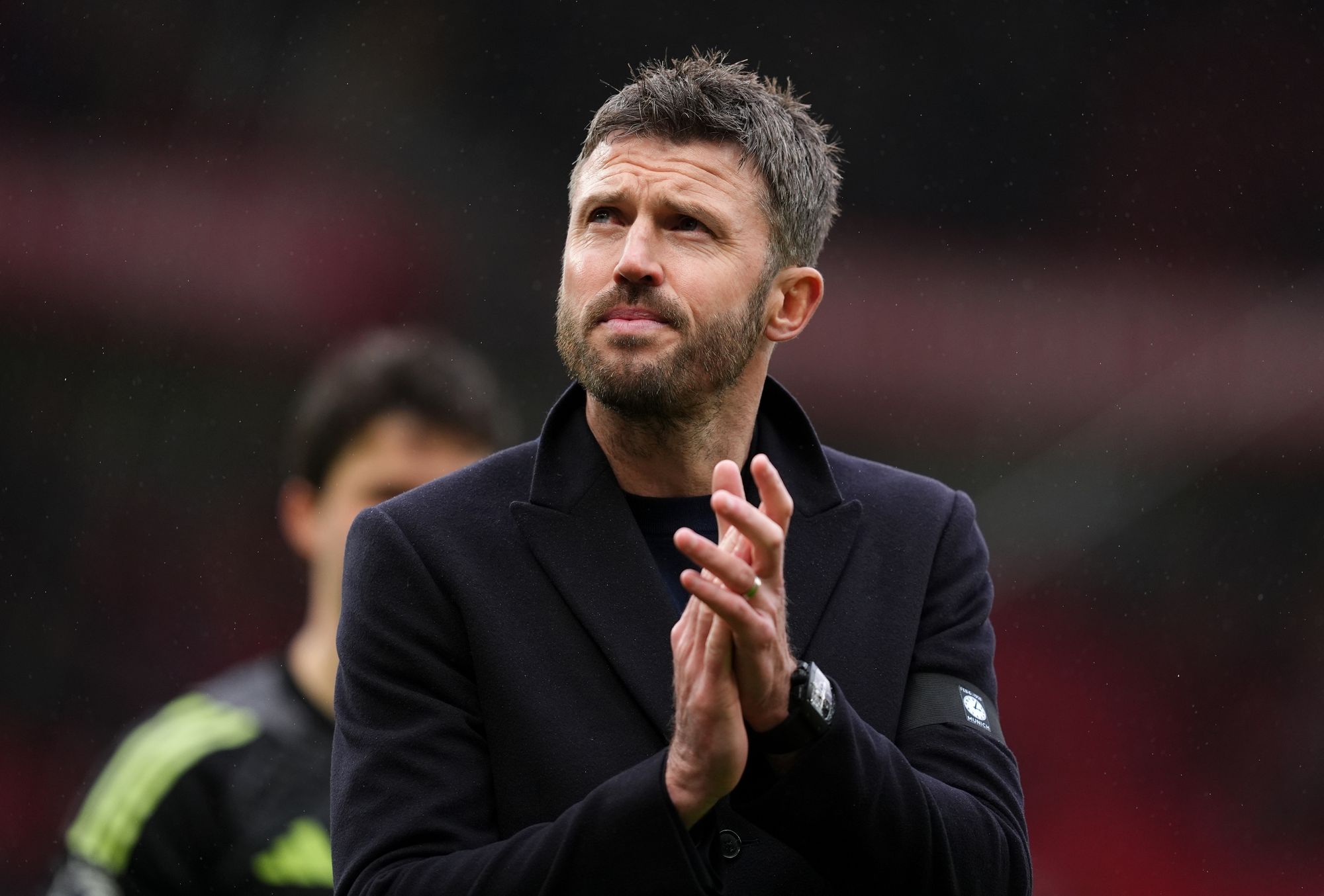 Michael Carrick applauds Manchester United fans after the club's win over Tottenham