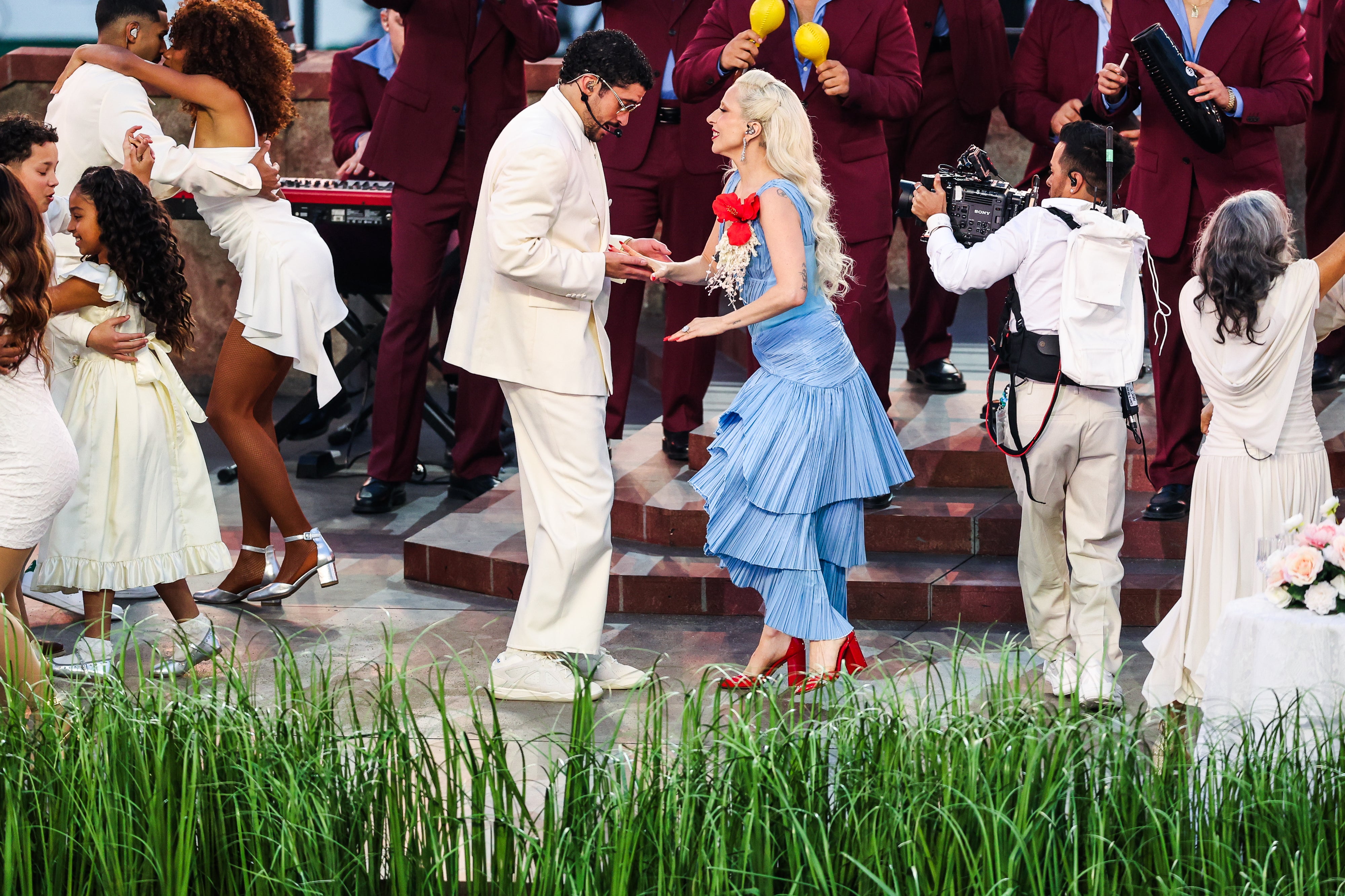 When Lady Gaga joined, Bad Bunny had added a double-breasted blazer to. his look