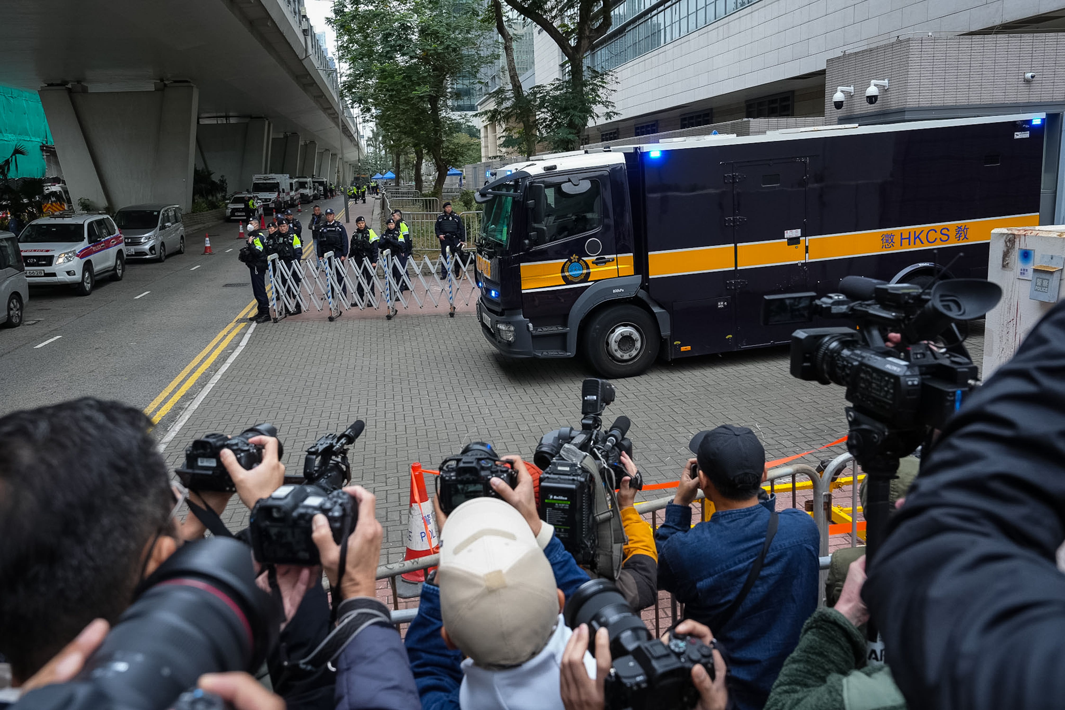 A Correctional Services Department vehicle believed to be carrying Mr Lai left the West Kowloon Magistrates’ Courts in Hong Kong on Monday (Chan Long Hei/AP)