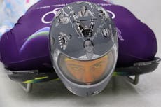 Ukrainian skeleton racer wears helmet paying tribute to athletes killed in Ukraine-Russia war at Winter Olympics