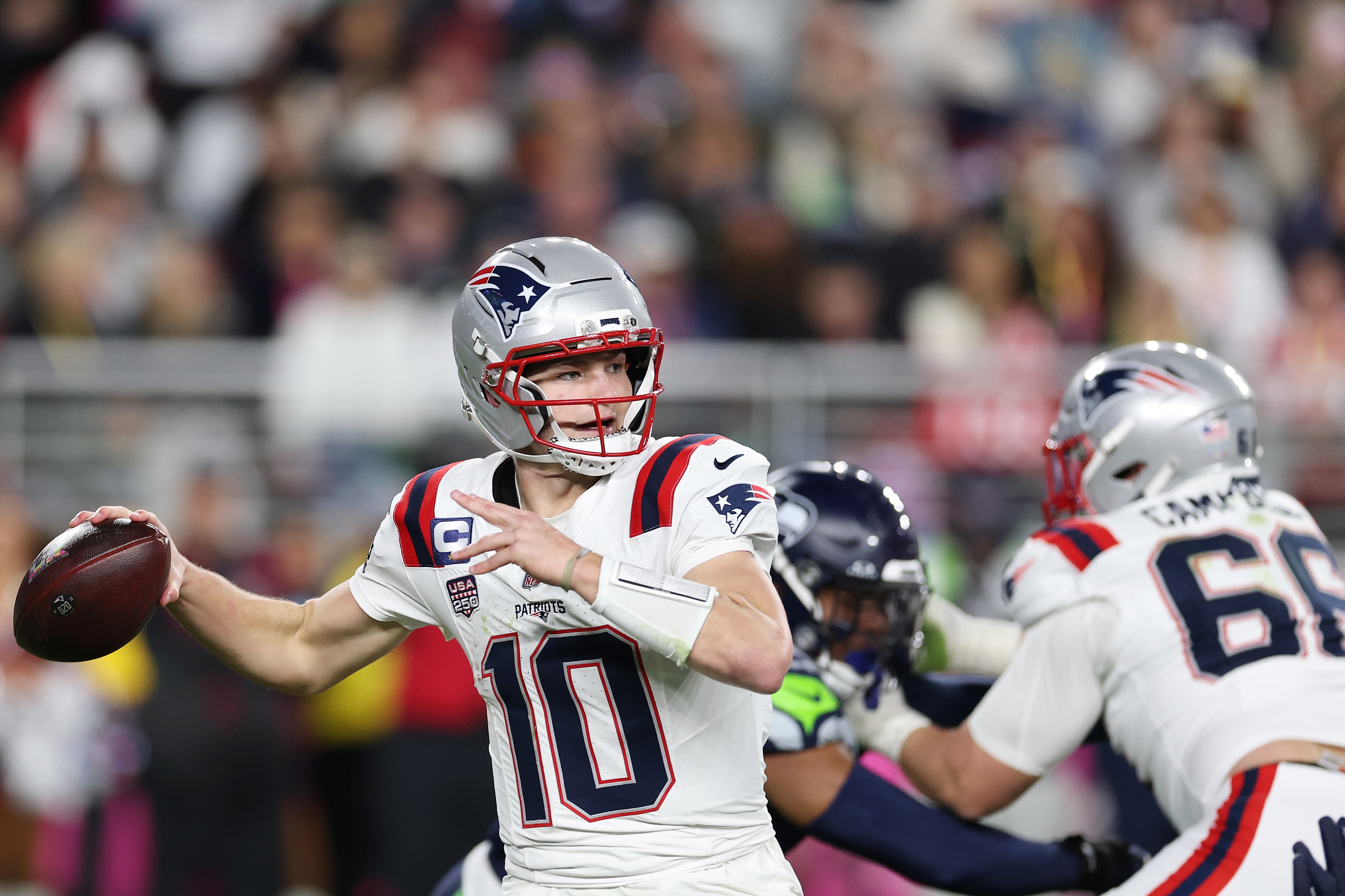 Drake Maye #10 of the New England Patriots throws a pass