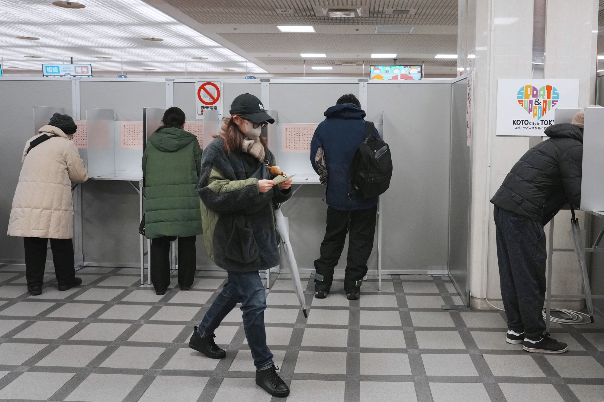 Voters take part in the House of Representatives election at a polling station in Tokyo on 8 February 2026