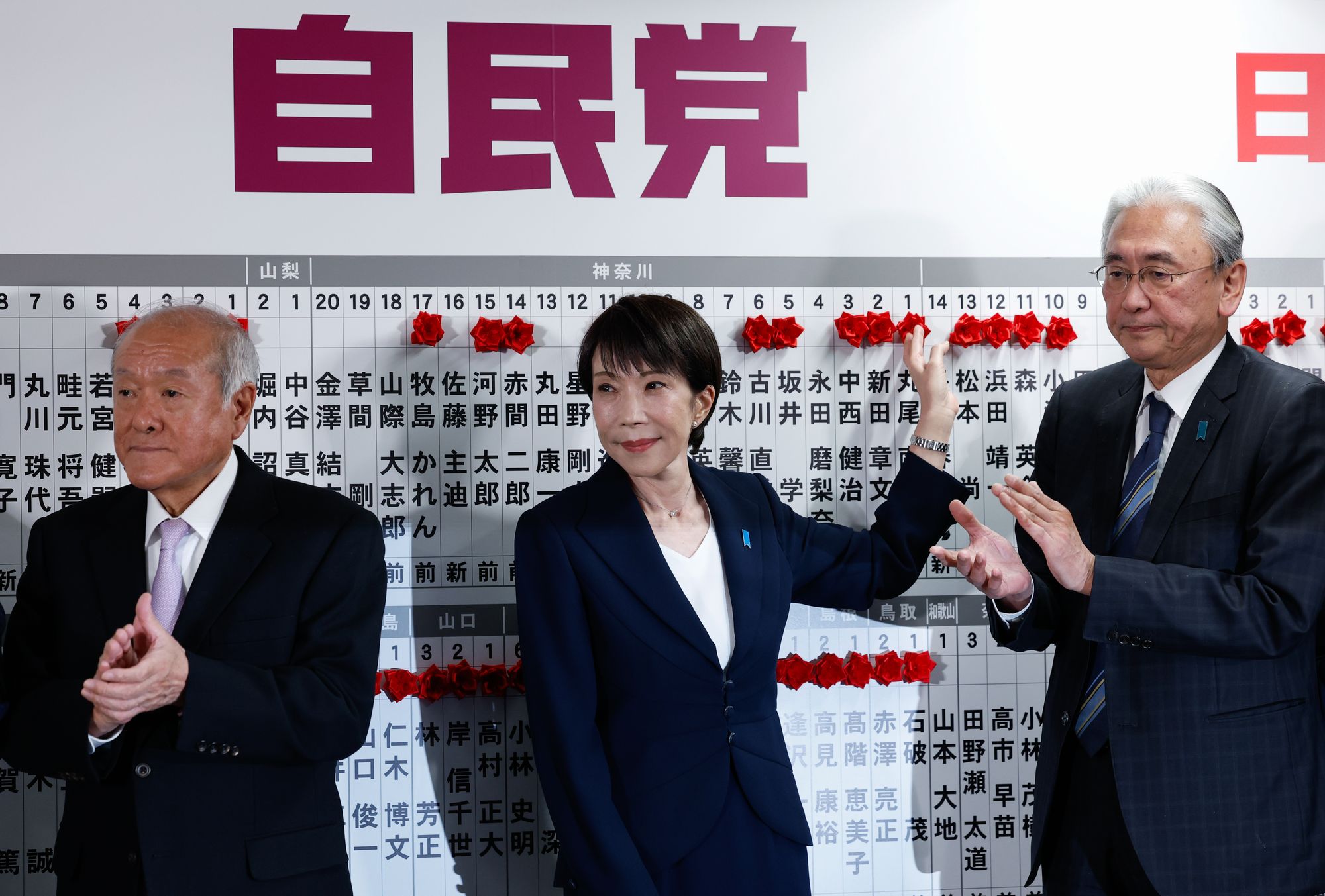 Japan's prime minister Sanae Takaichi, leader of the ruling Liberal Democratic Party (LDP), next to LDP secretary-general Shunichi Suzuki and LDP election strategy chief Keiji Furuya