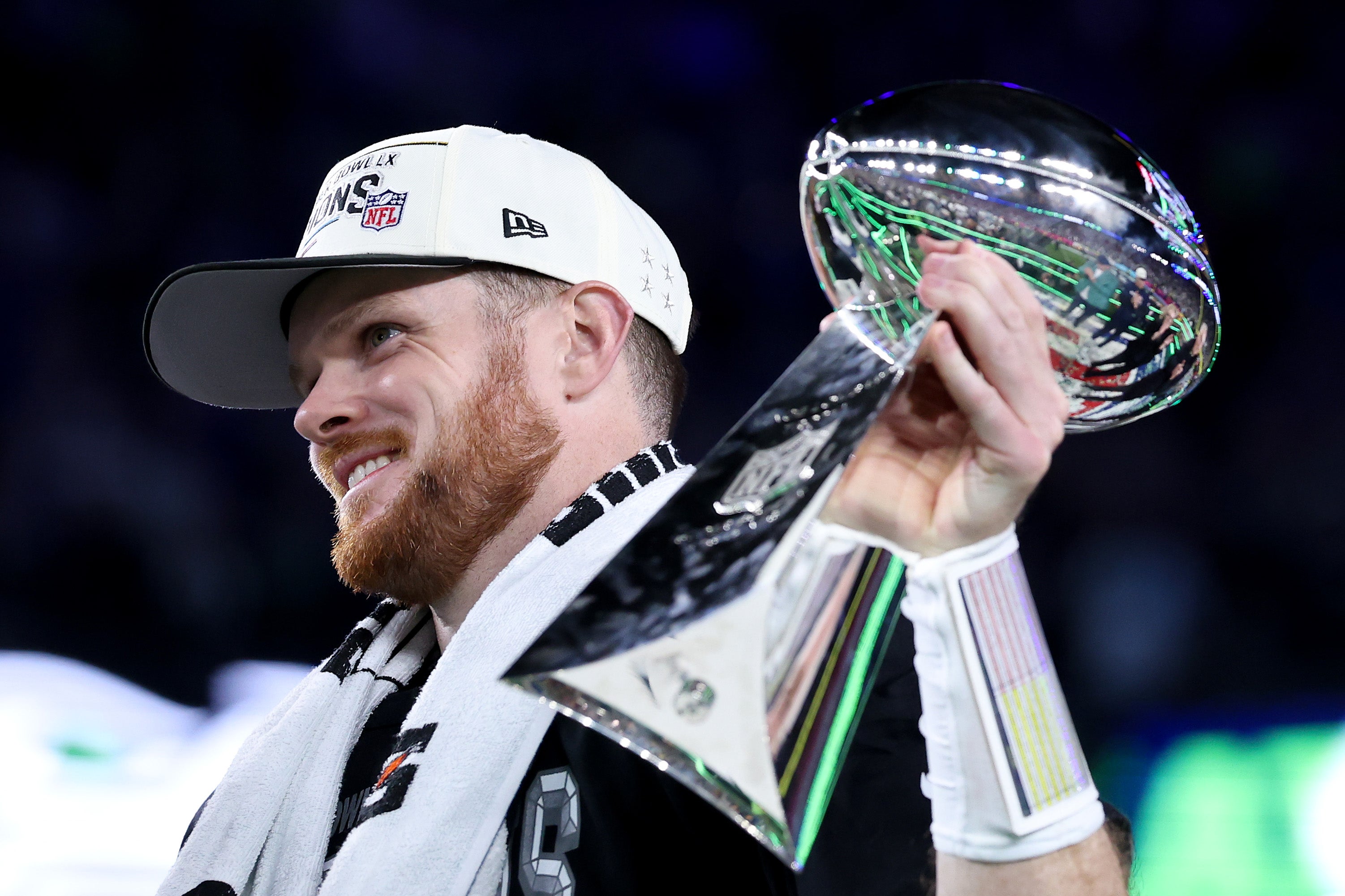 Sam Darnold #14 of the Seattle Seahawks celebrates with the Vince Lombardi Trophy