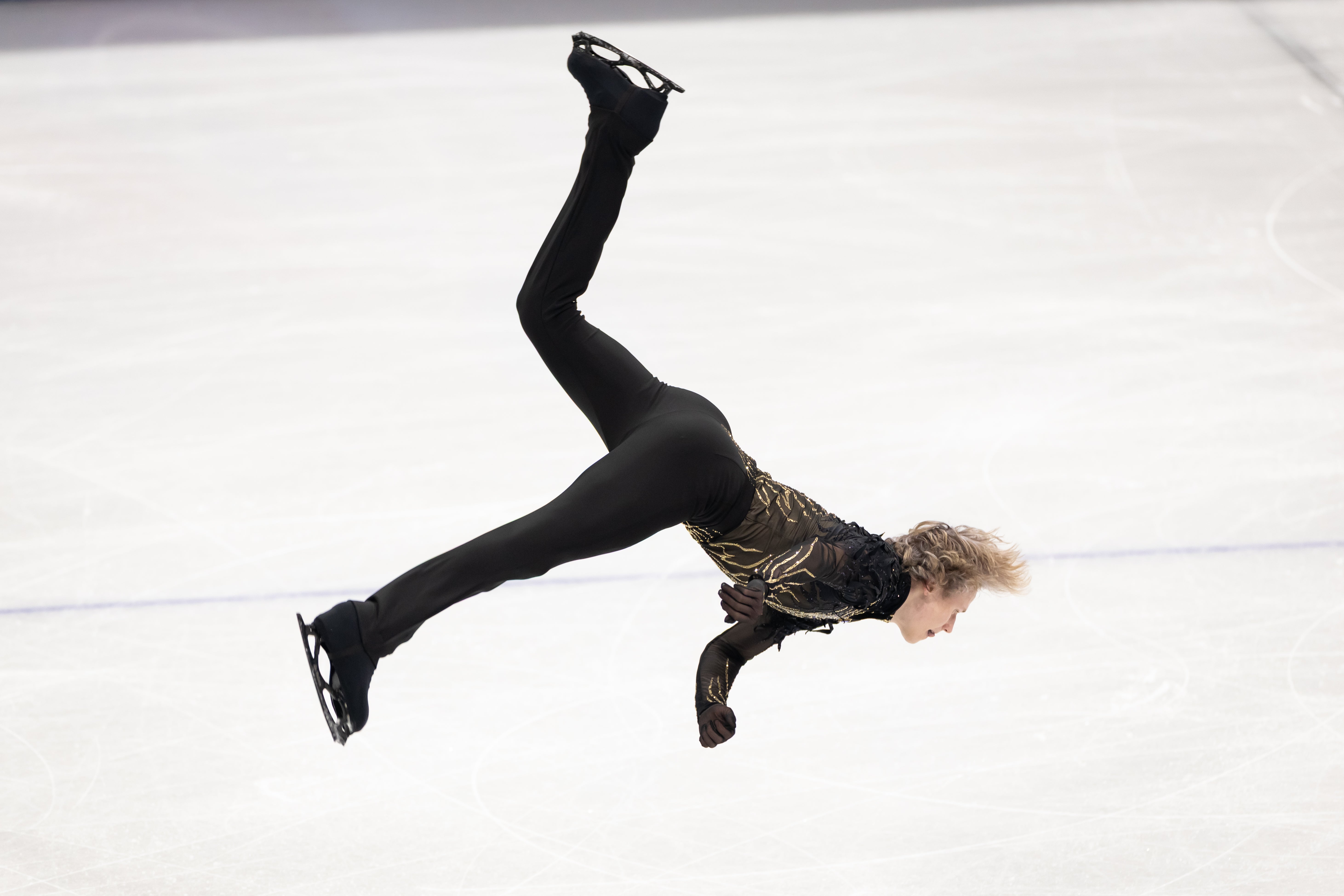 Ilia Malinin performing an impressive backlip en route to winning Olympic gold