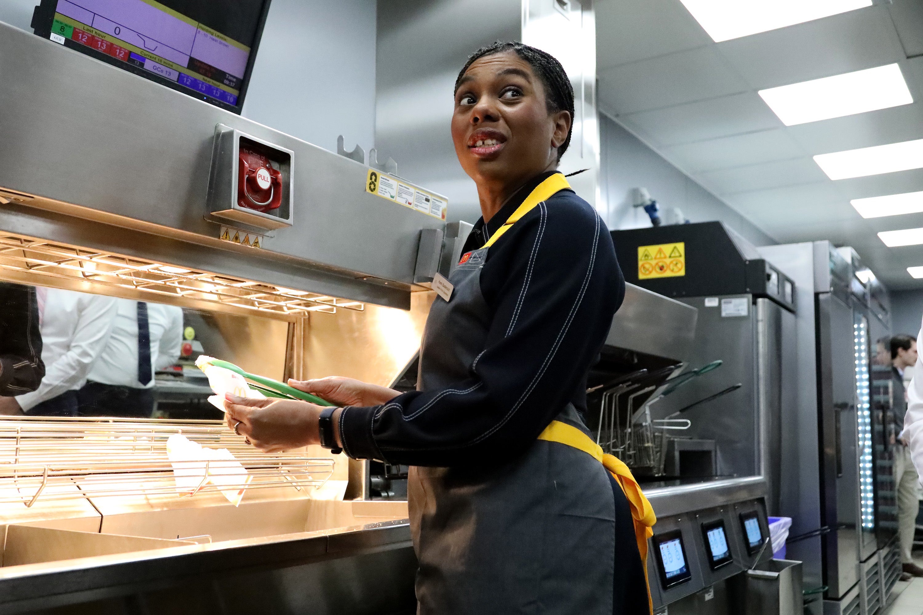 During her stint in the kitchen, Ms Badenoch wore a personalised name badge that featured the title "Leader of the Opposition".