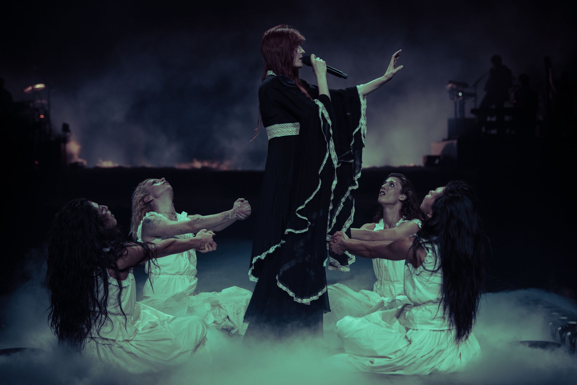 Florence Welch is surrounded by her Witch Choir during the opening night of her Everybody Scream tour