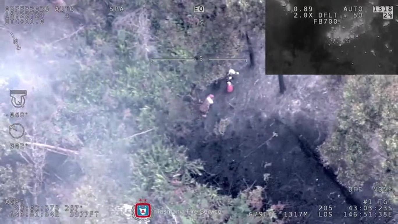 Woman rescued from middle of Australian bushfire after being spotted by helicopter crew