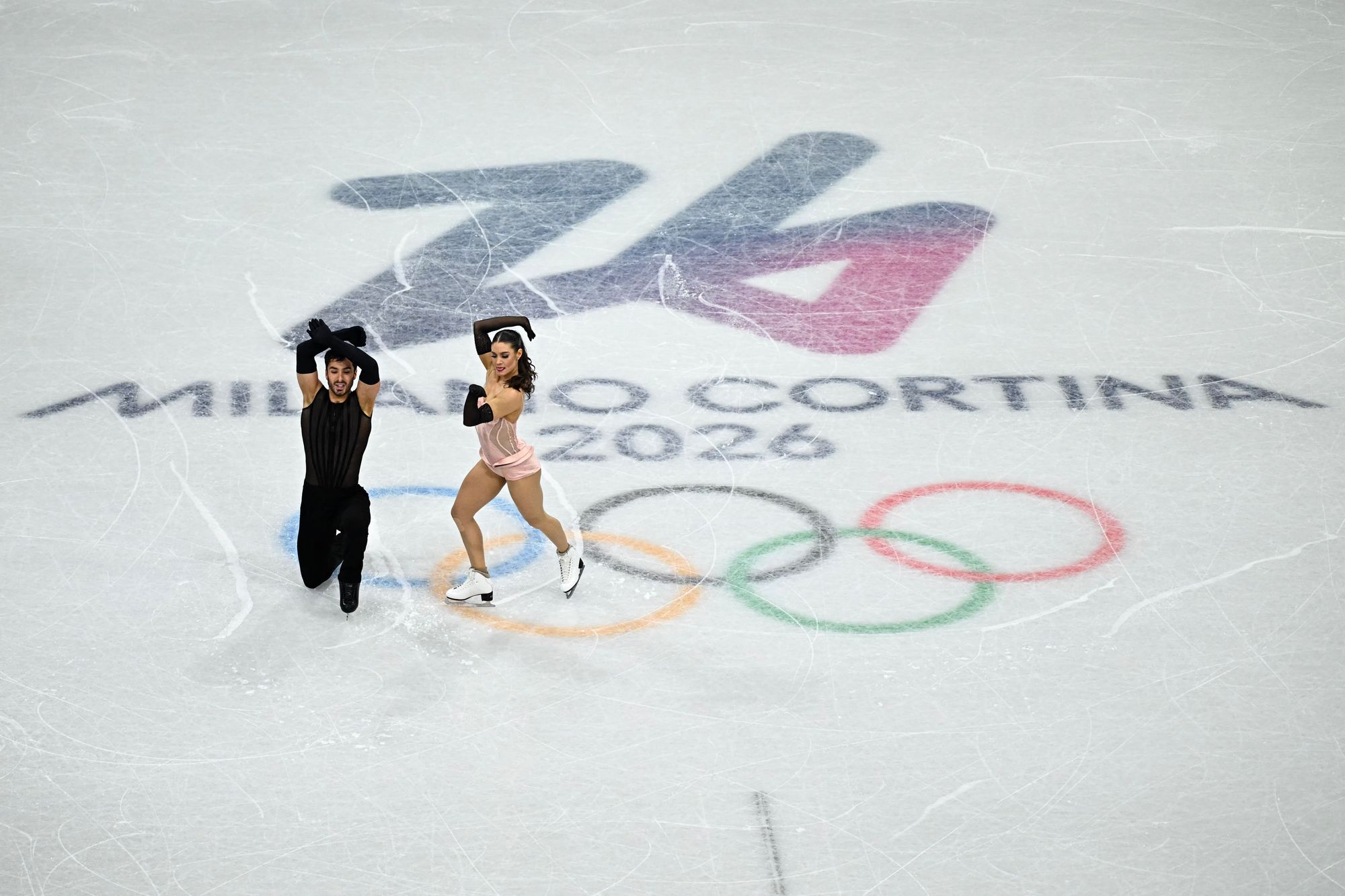 Laurence Fournier Beaudry and Guillaume Cizeron compete in the figure skating team event ice dance-rhythm dance