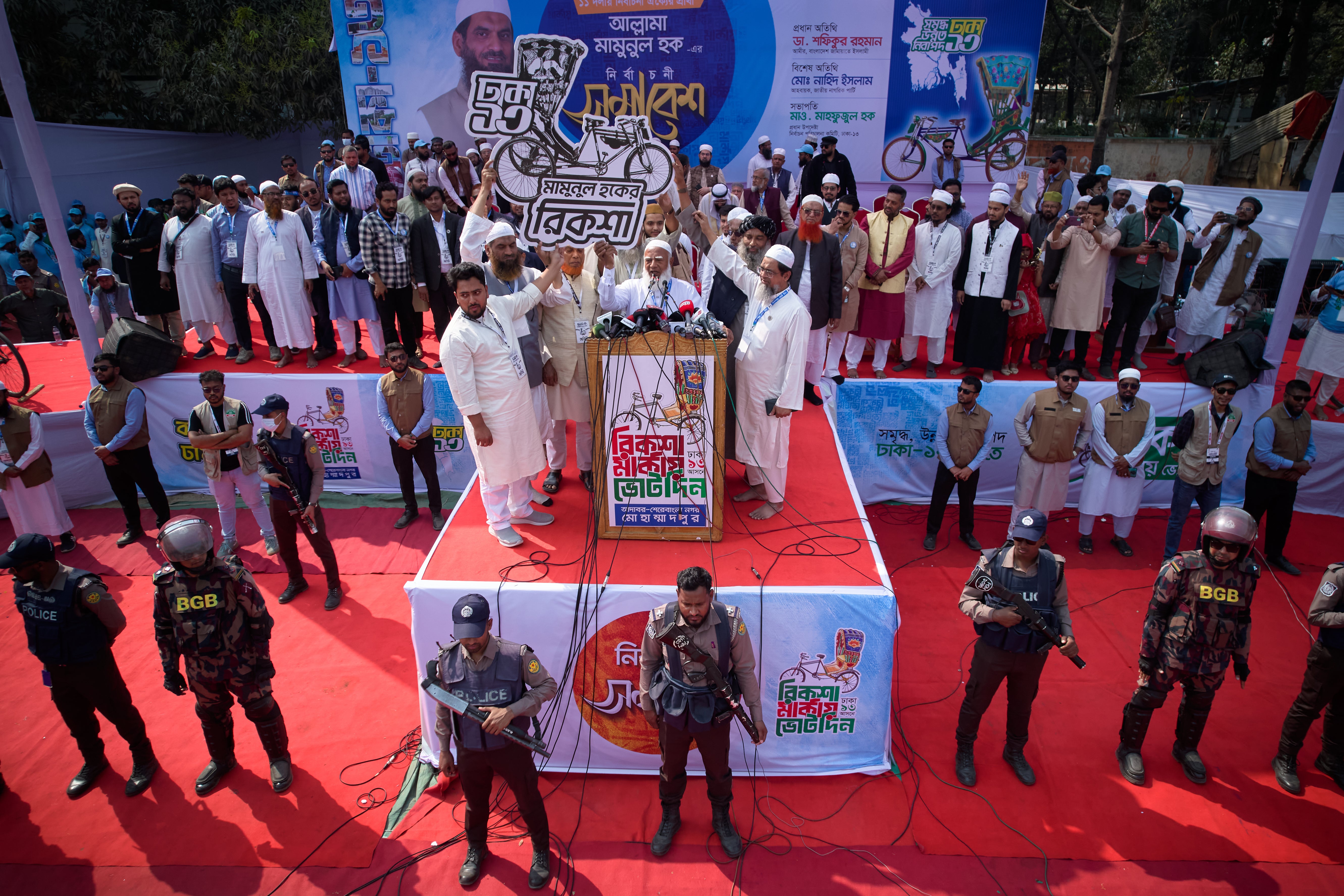 Jamaat-e-Islami leader Shafiqur Rahman, centre, and other leaders hold their election symbol during the last day of an election rally for Bangladesh Khilafat Majlis candidate Mamunul Haque, organized by the eleven party alliance in Dhaka, Bangladesh, Monday, 9 Feb 2026