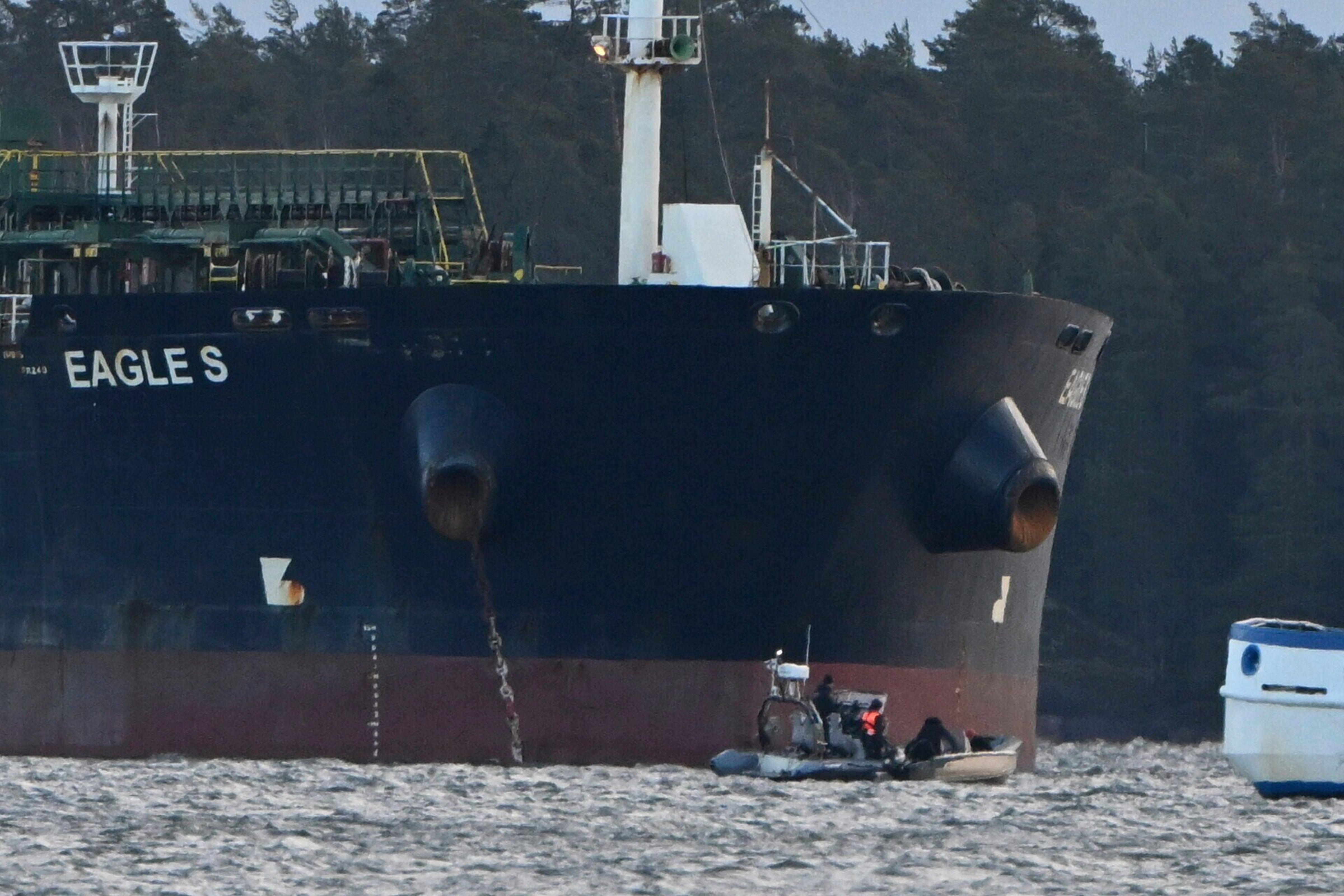 Finnish Coast Guard stops a small boat which tried to reach the Cook Islands-registered oil tanker Eagle S anchored near the Kilpilahti port in Porvoo, on the Gulf of Finland