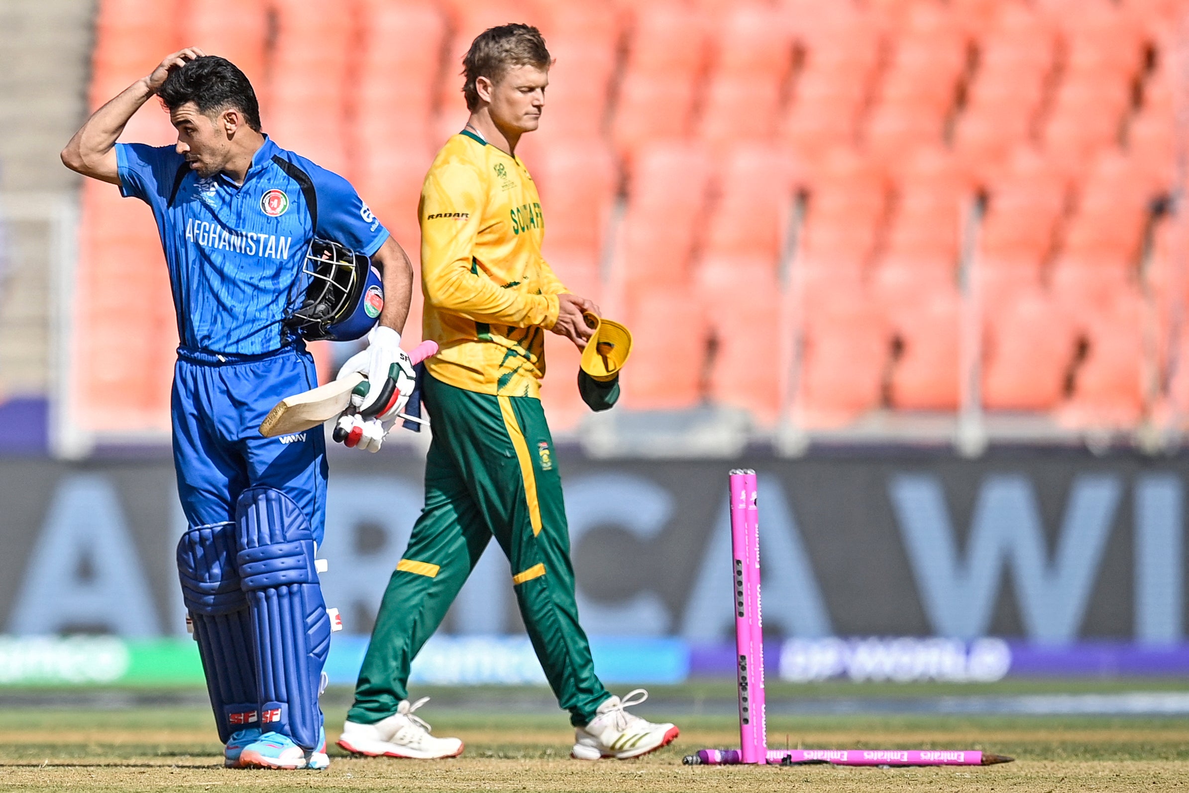 Afghanistan's Rahmanullah Gurbaz (L) reacts after his team's loss against South Africa at the end of their 2026 ICC Men's T20 Cricket World Cup group stage