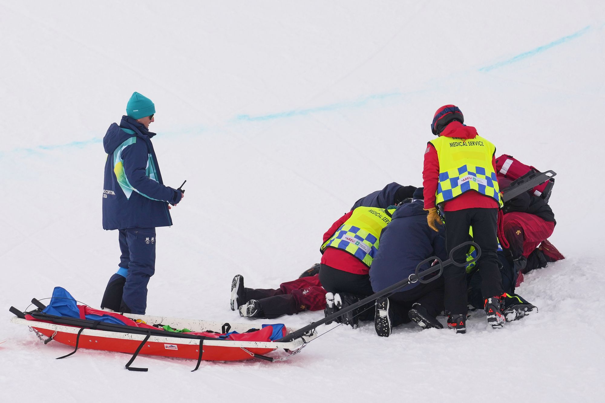 Medics tend to China's Liu Jiayu after she crashed during the women's snowboarding halfpipe qualifications at the 2026 Winter Olympics