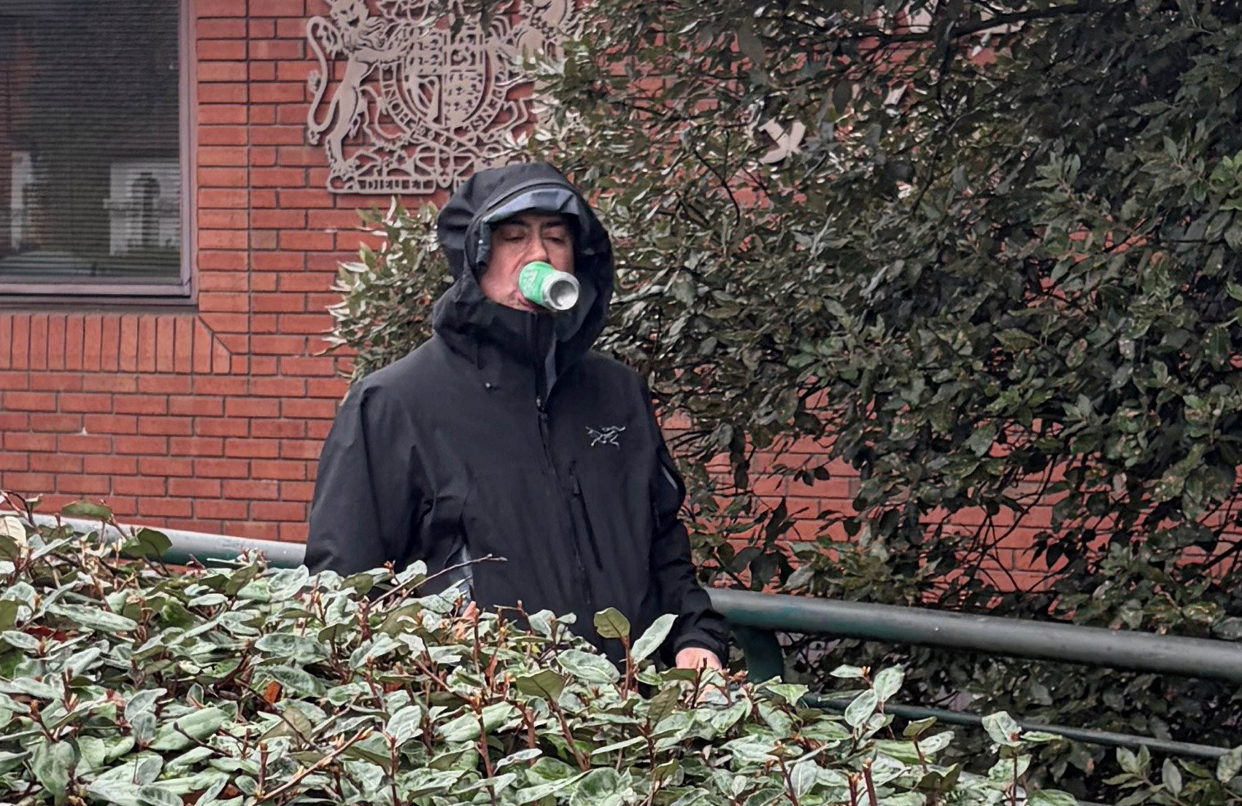 Dr Martin Kuper leaves Wimbledon Magistrates' Court. He is accused of exposing himself in front of the woman as she enjoyed the sunshine in Battersea Park last Apri