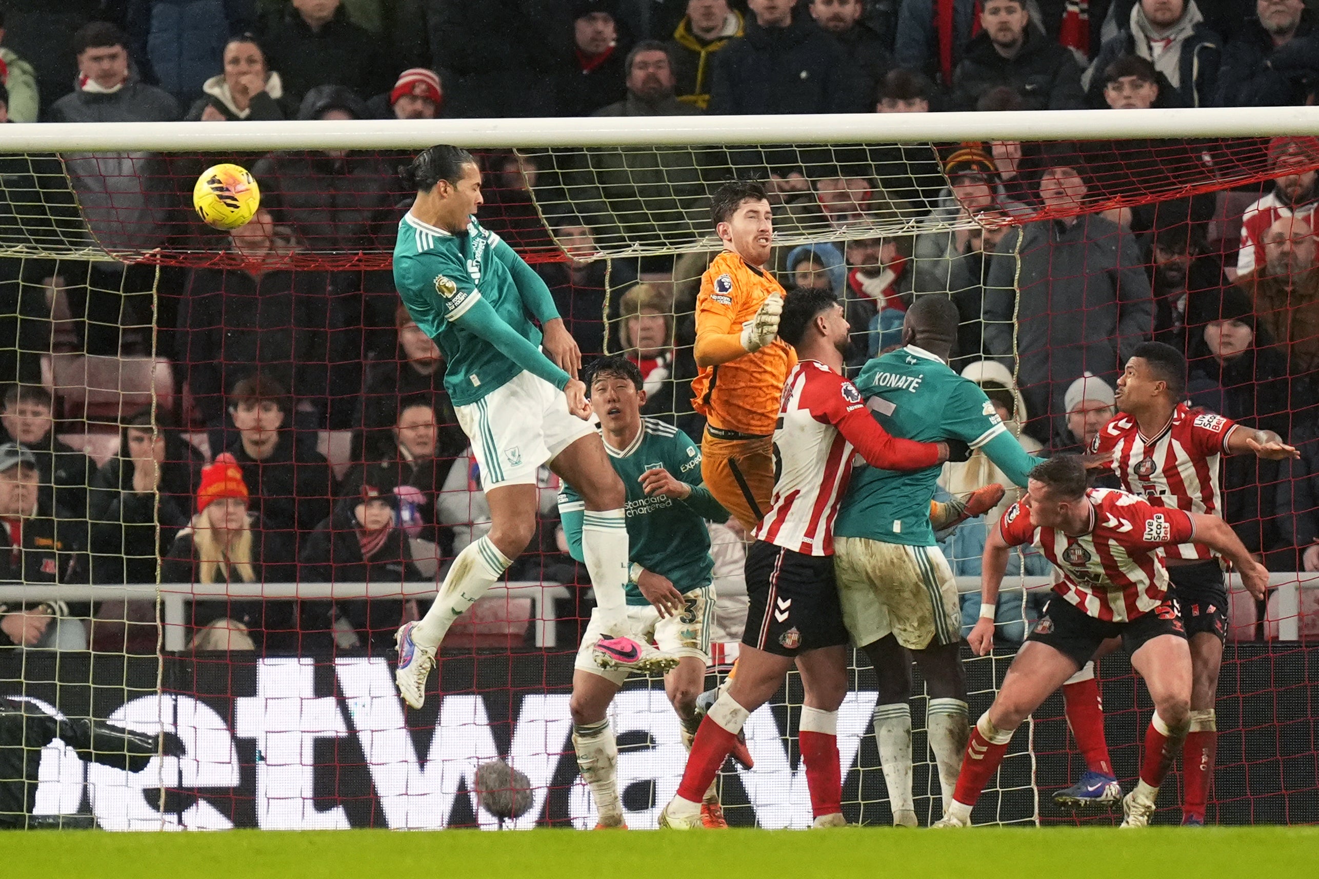 Virgil van Dijk heads home (Danny Lawson/PA)
