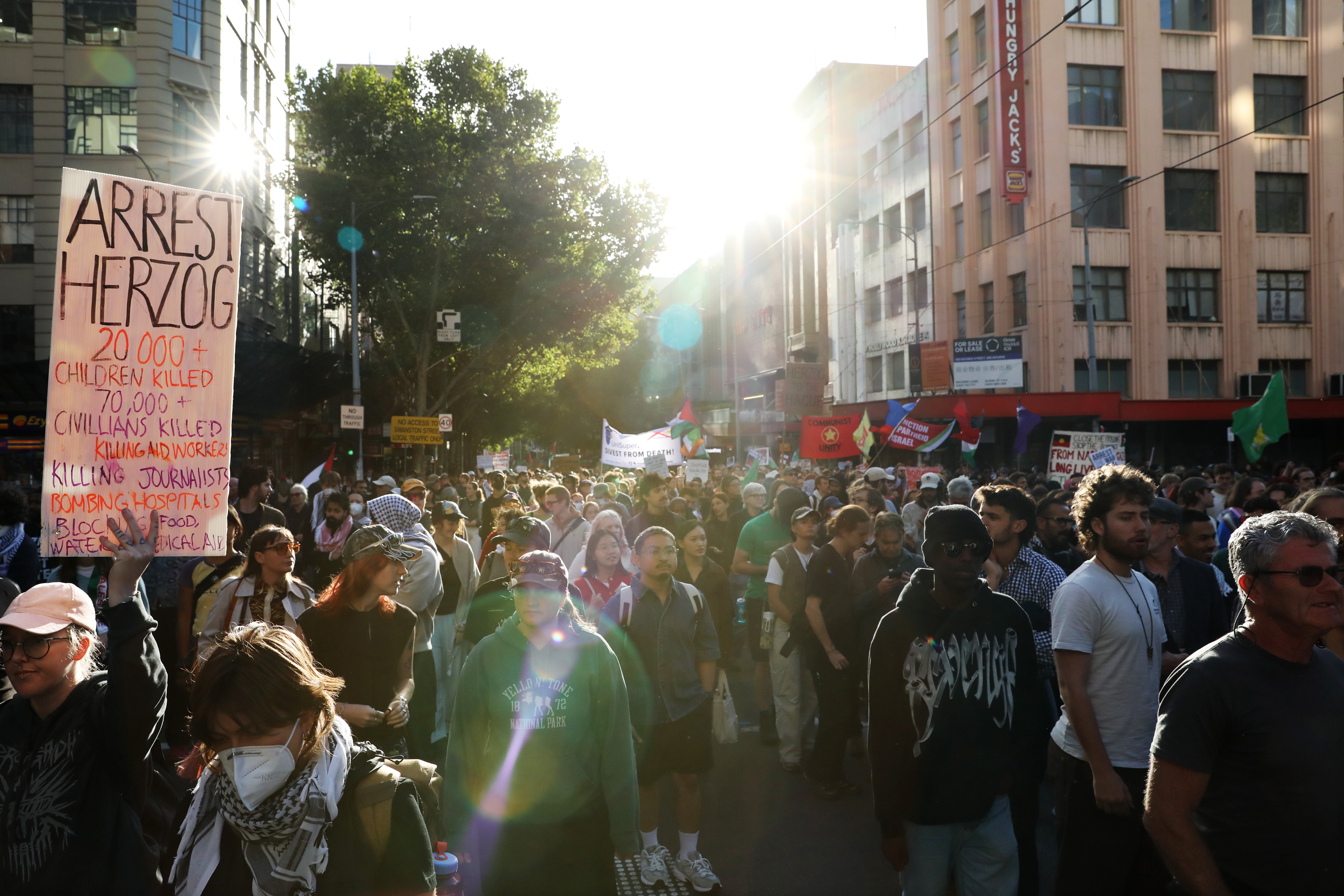 Pro-Palestine supporters march through the central business district (CBD) to protest against the visit of Israel’s president, Isaac Herzog, on 12 February 2026 in Melbourne, Australia