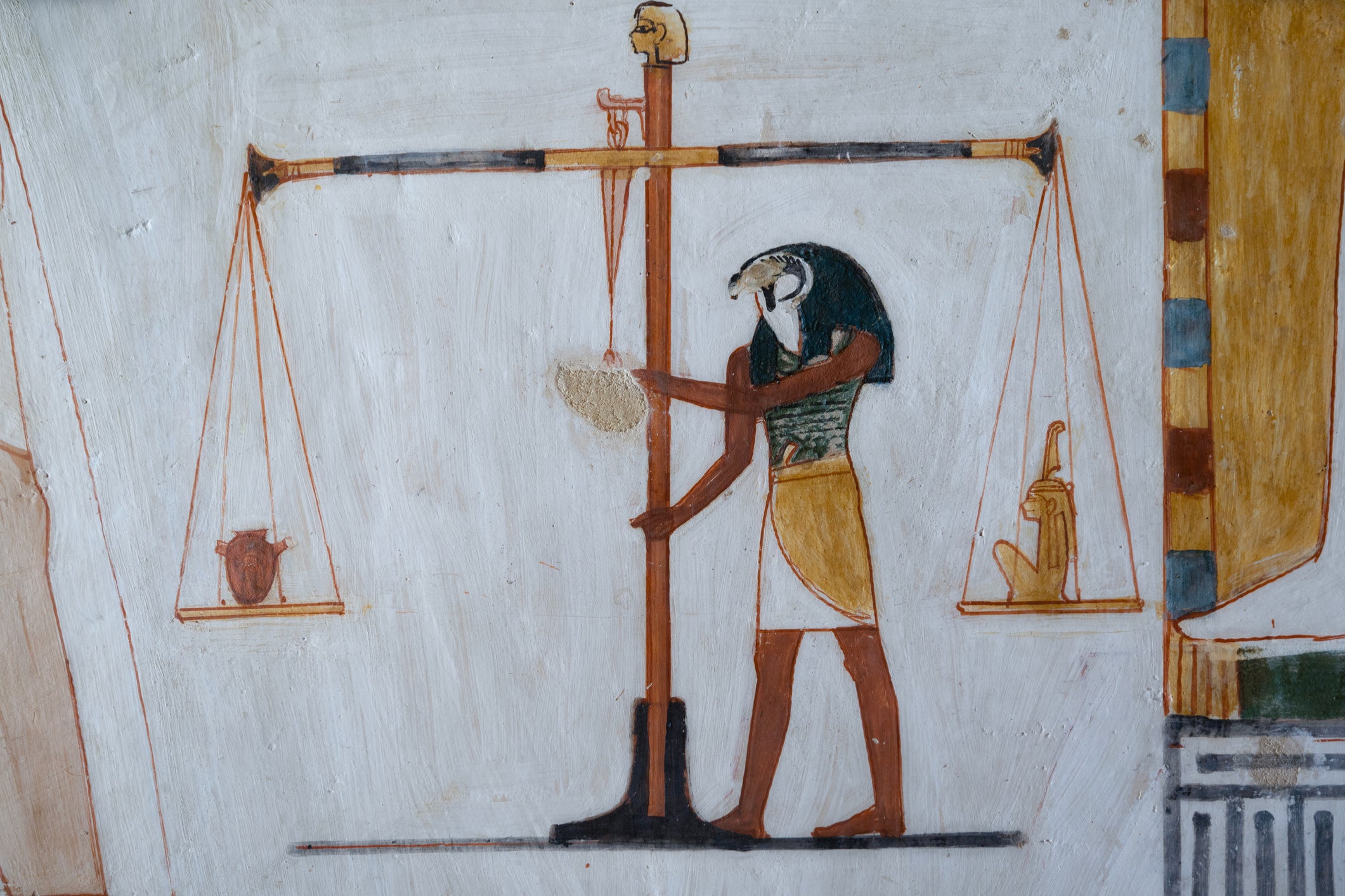 The Ancient Egyptian god Horus weighs a heart against Maat in final judgement.