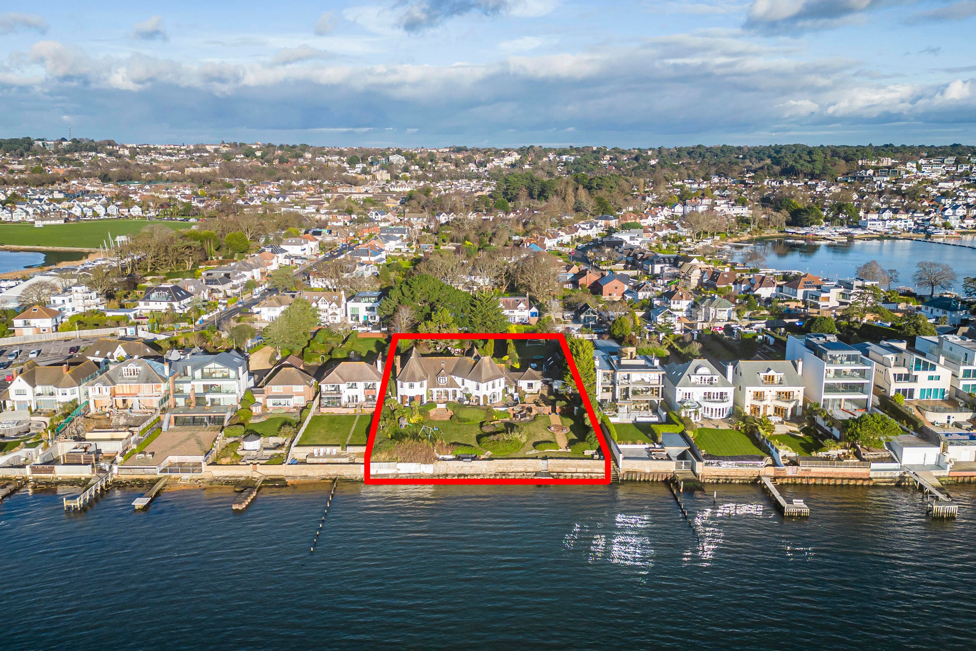 Michael Dennis and wife Angela have secured planning permission to level the five-bed Arts & Craft-style home that is one of the finest on the waterfront of Poole Harbour in Dorset