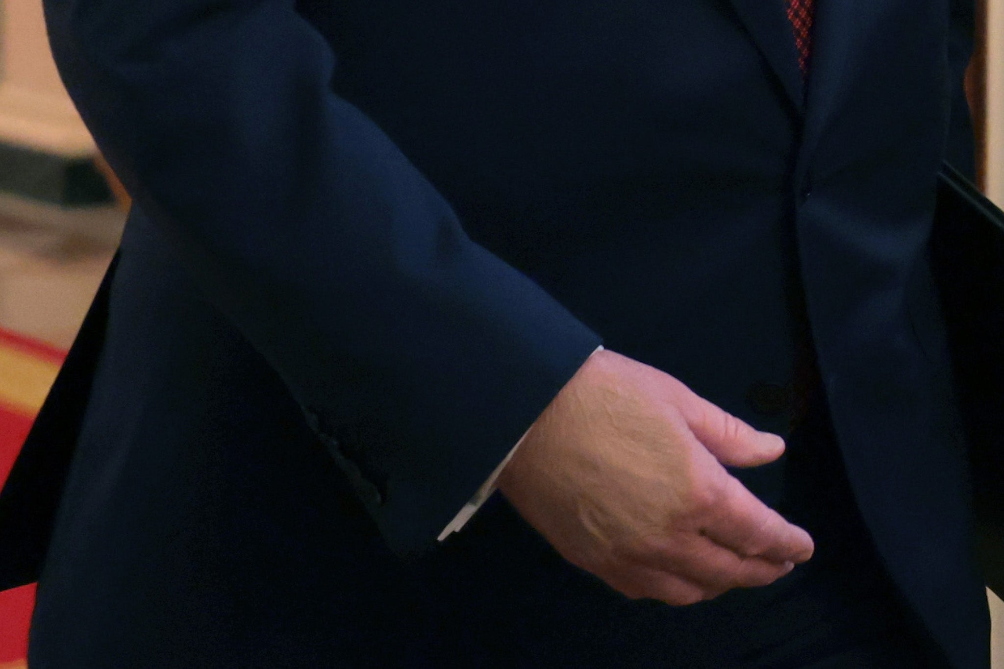 A closeup of President Donald Trump’s right hand on February 11, 2026. Makeup appears to be covering a bruise on his hand. The president has had bruises on both of his hands for more than a year