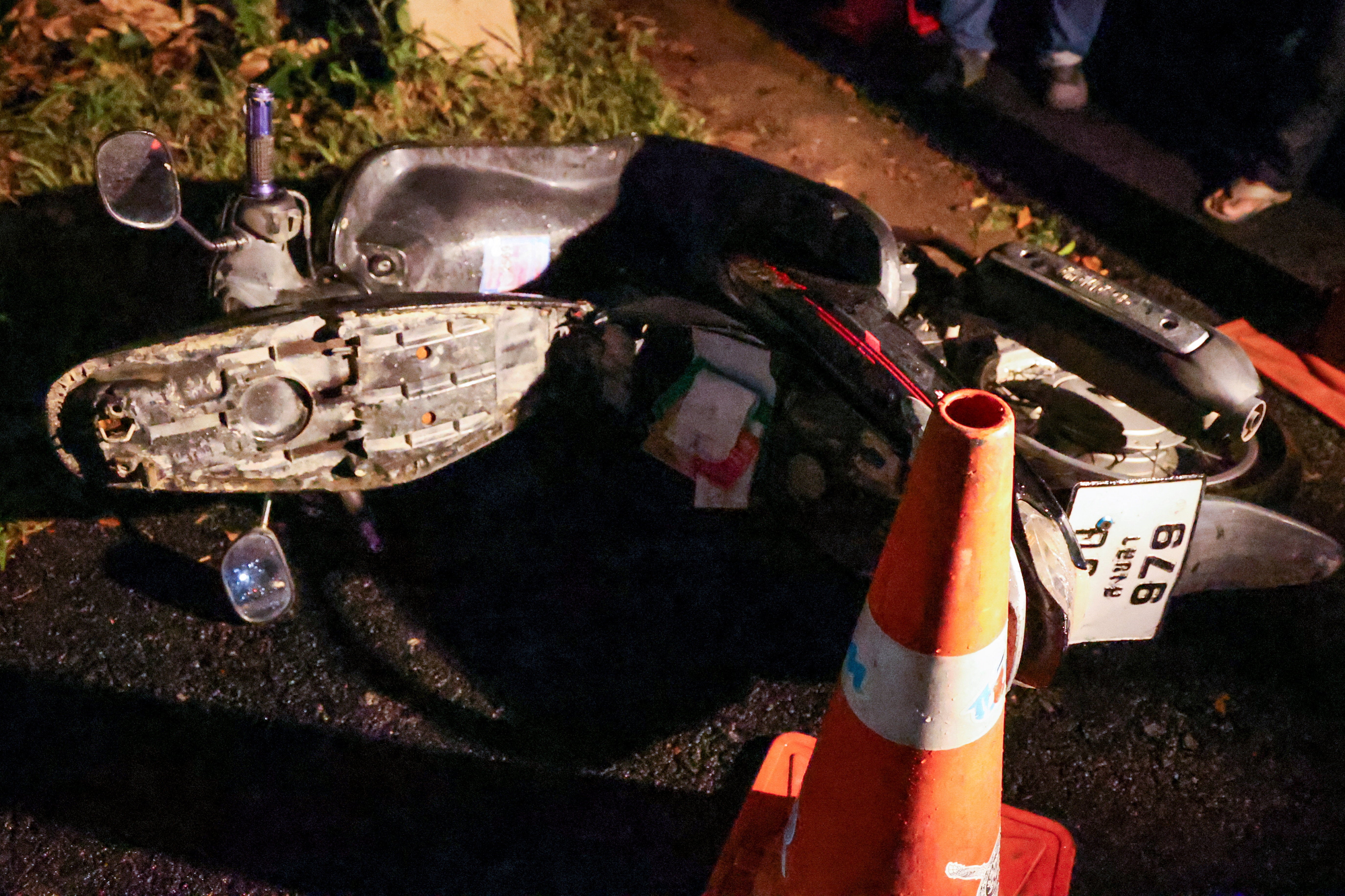 A motorbike near the gate of the Patongprathankiriwat School, which, according to police, is believed to belong to the gunman, after he entered and held an unknown number of students and teachers hostage, in southern Thailand’s Songkhla, 11 February 2026